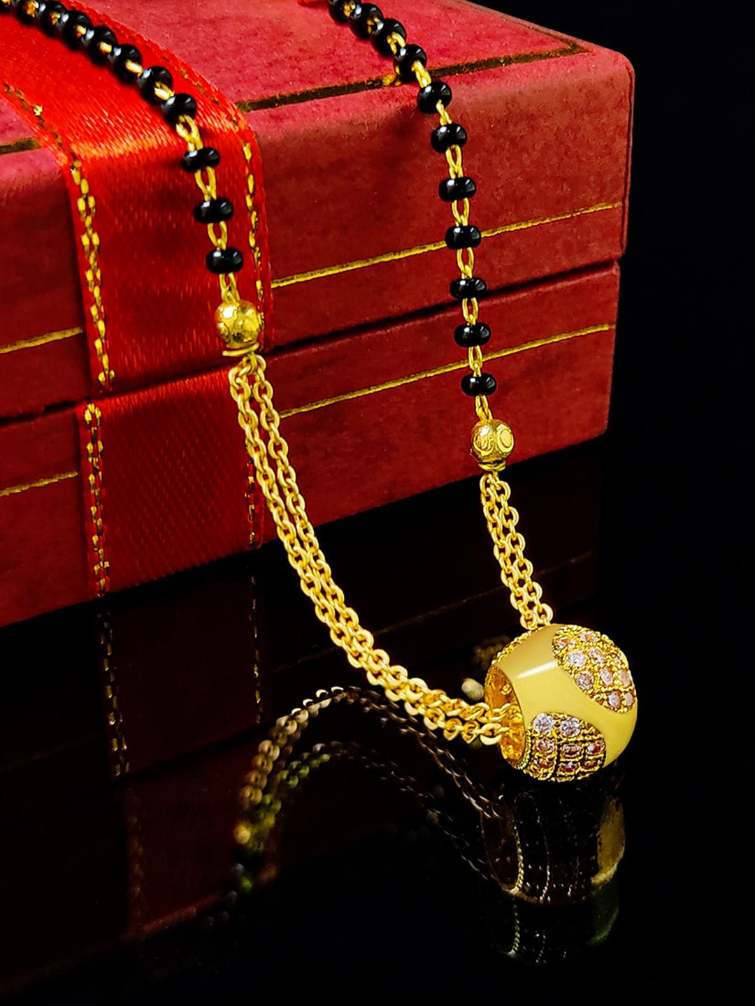 

Saizen Gold-Plated White AD Studded Black Beaded Mangalsutra