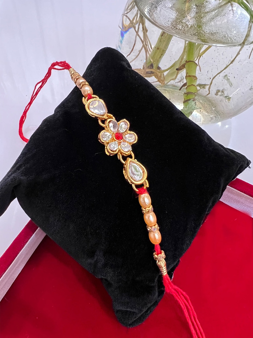 

Vembley Men Set Of 4 Gold-Toned & Red Kundan-Studded & Beaded Flower Design Rakhi