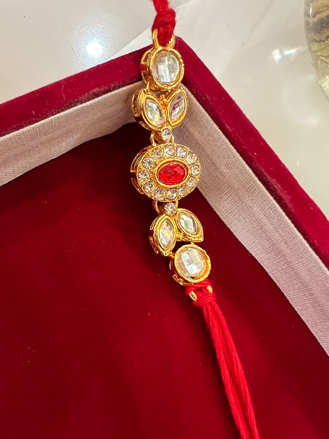 

Vembley Men Set Of 5 Gold-Toned White & Red Kundan-Studded Rakhi