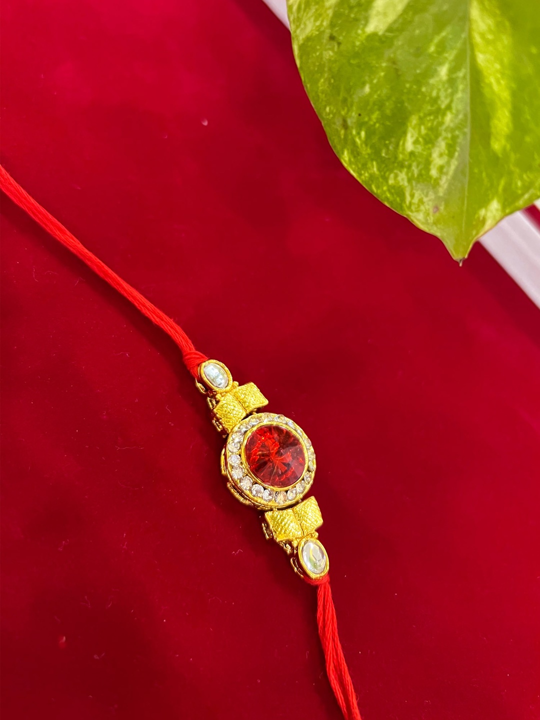

Vembley Men Set Of 3 Gold-Toned White & Red Kundan-Studded Rakhi