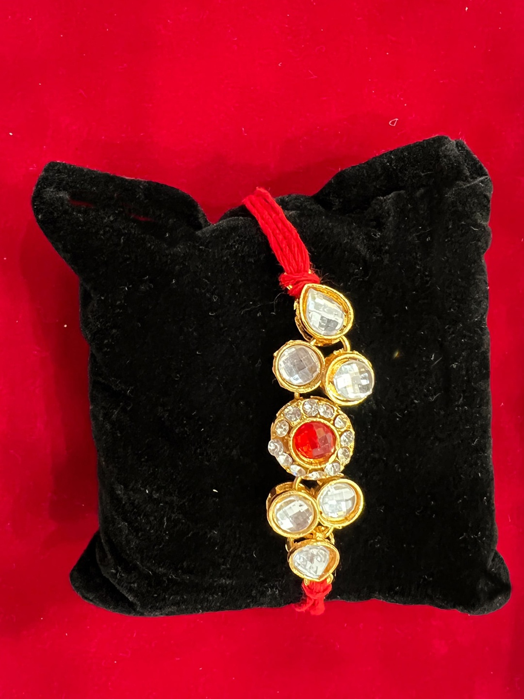 

Vembley Men Set of 5 Gold-Toned Red & White Kundan Studded Thread Rakhi
