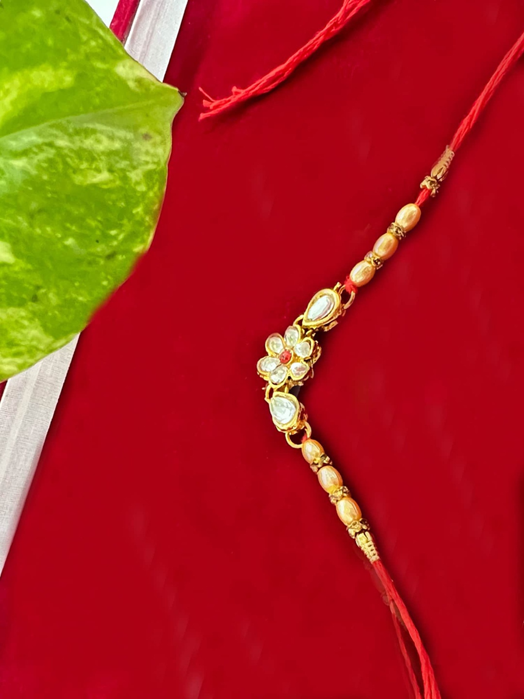 

Vembley Set Of 4 Gold-Colored Red & White Kundan-Studded & Beaded Rakhi