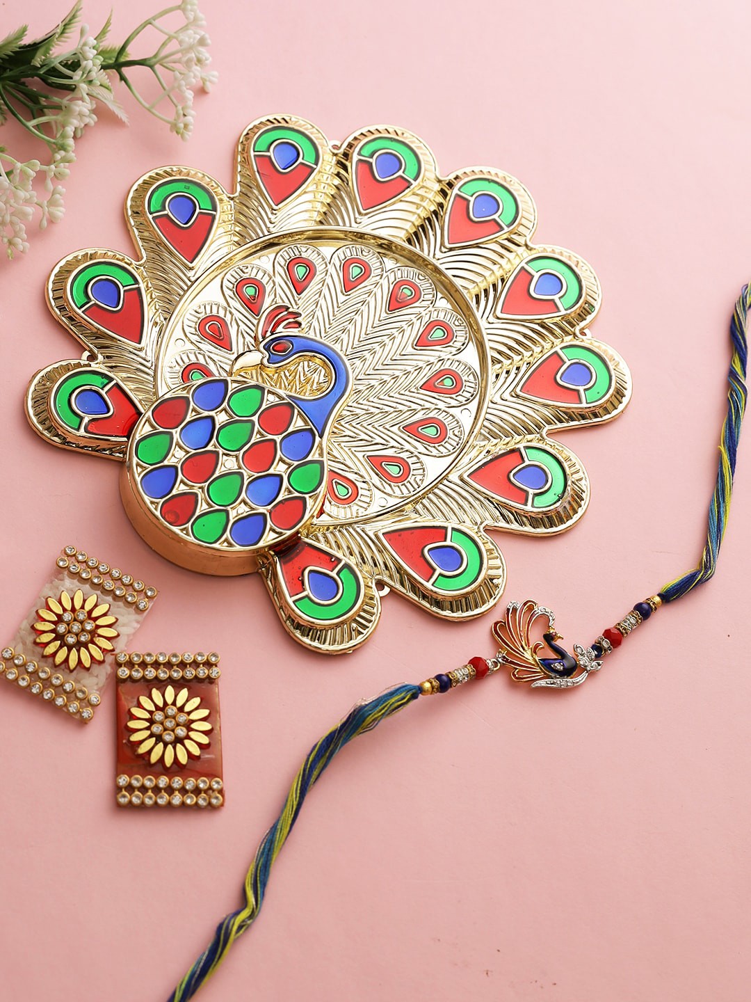 

Aapno Rajasthan Peacock Roli Chawal Thali with Traditional Designs Rakhi Combo Set, Multi