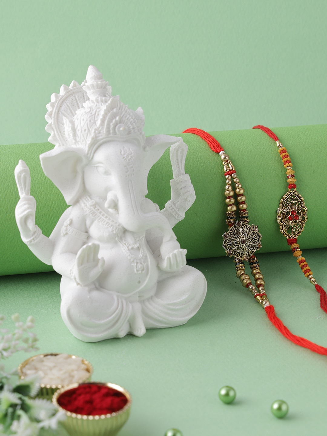 

Aapno RajasthanPolyresin Ganesha Idol with Set of 2 Rakhi Gift Set, Multi