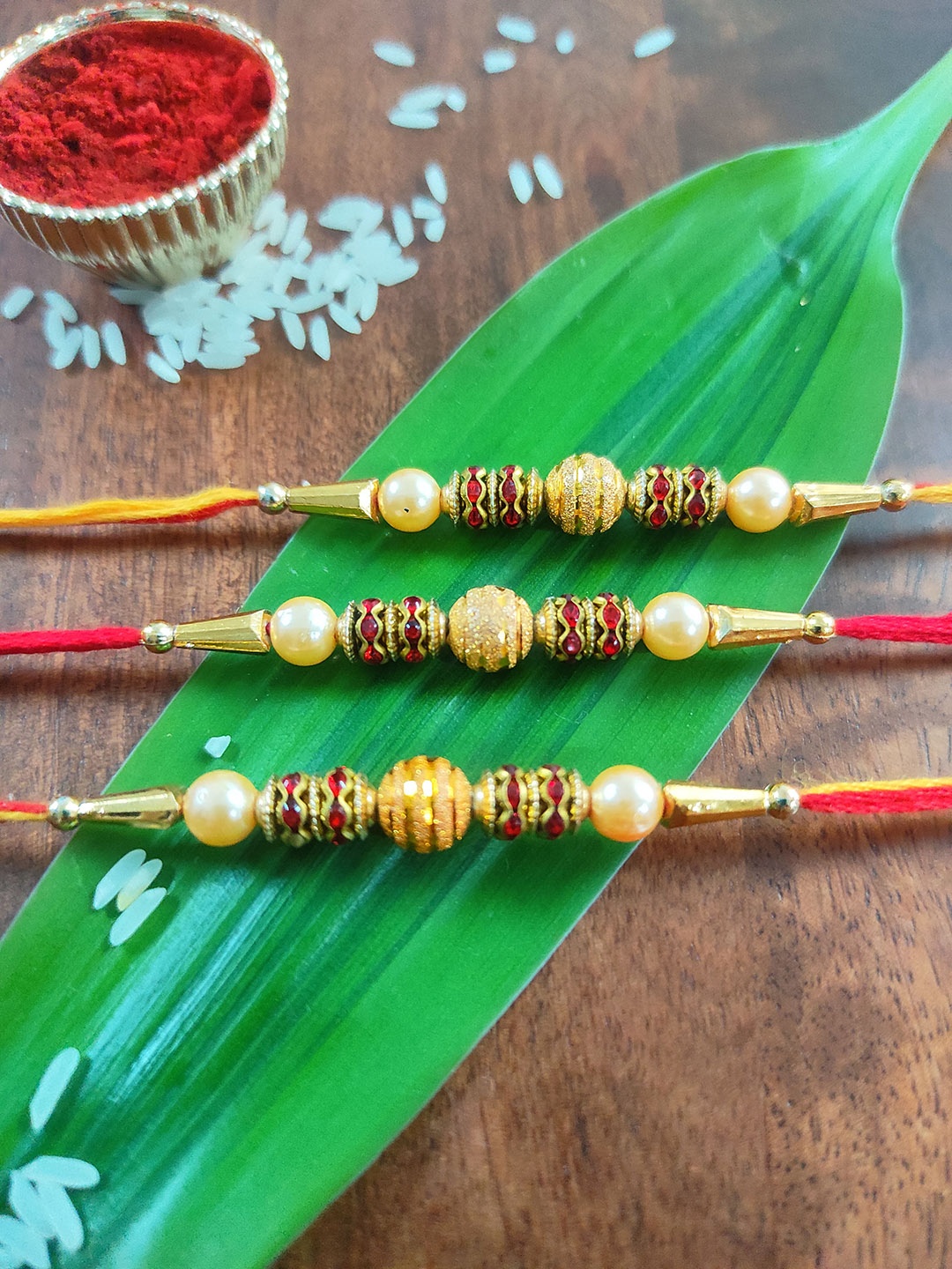 

CRAYTON Men Set of 3 Gold-Toned Red Stone-Studded & Beaded Rakhi