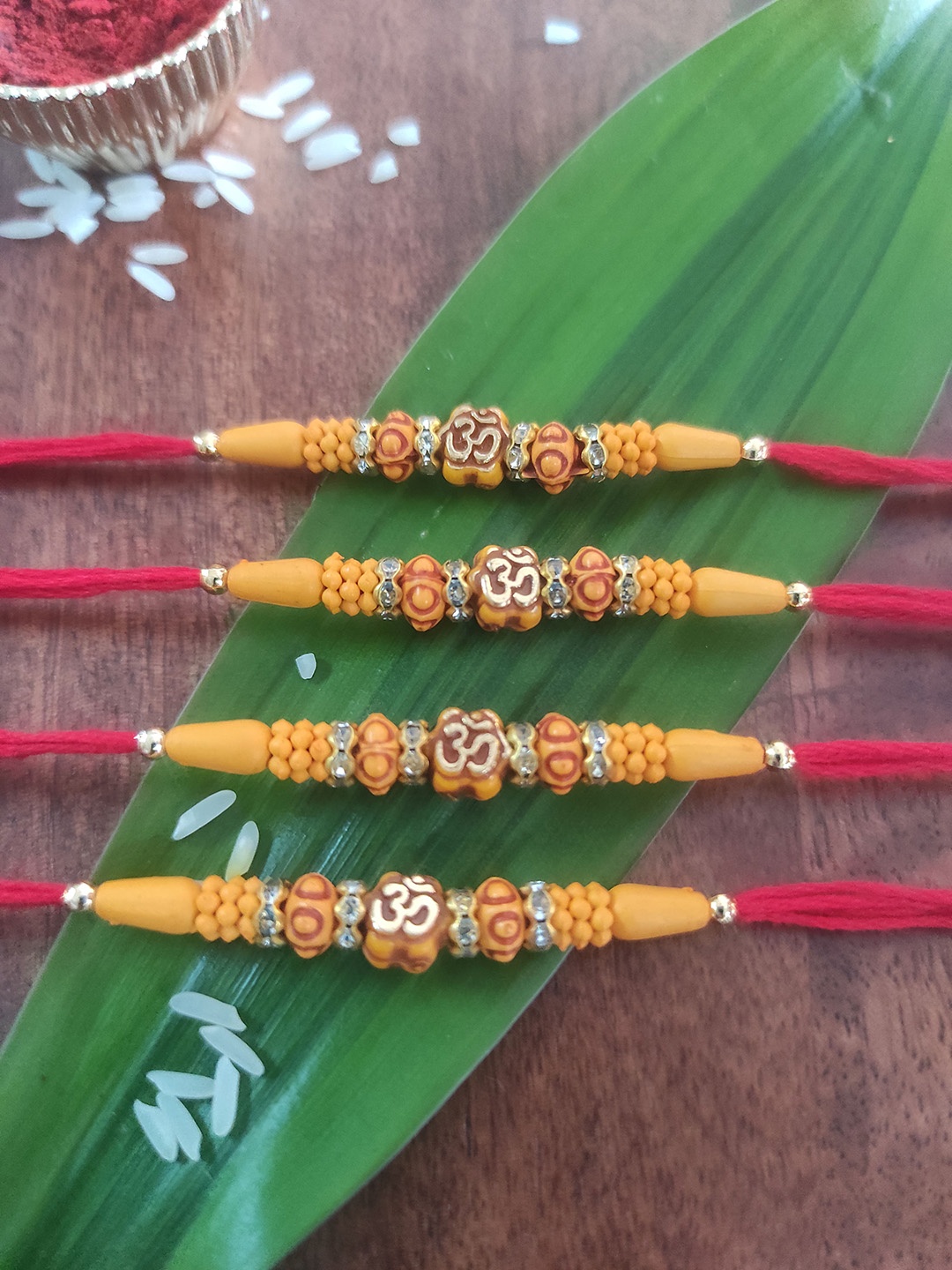 

CRAYTON Set Of 4 Pink & Yellow Beaded Thread Rakhi