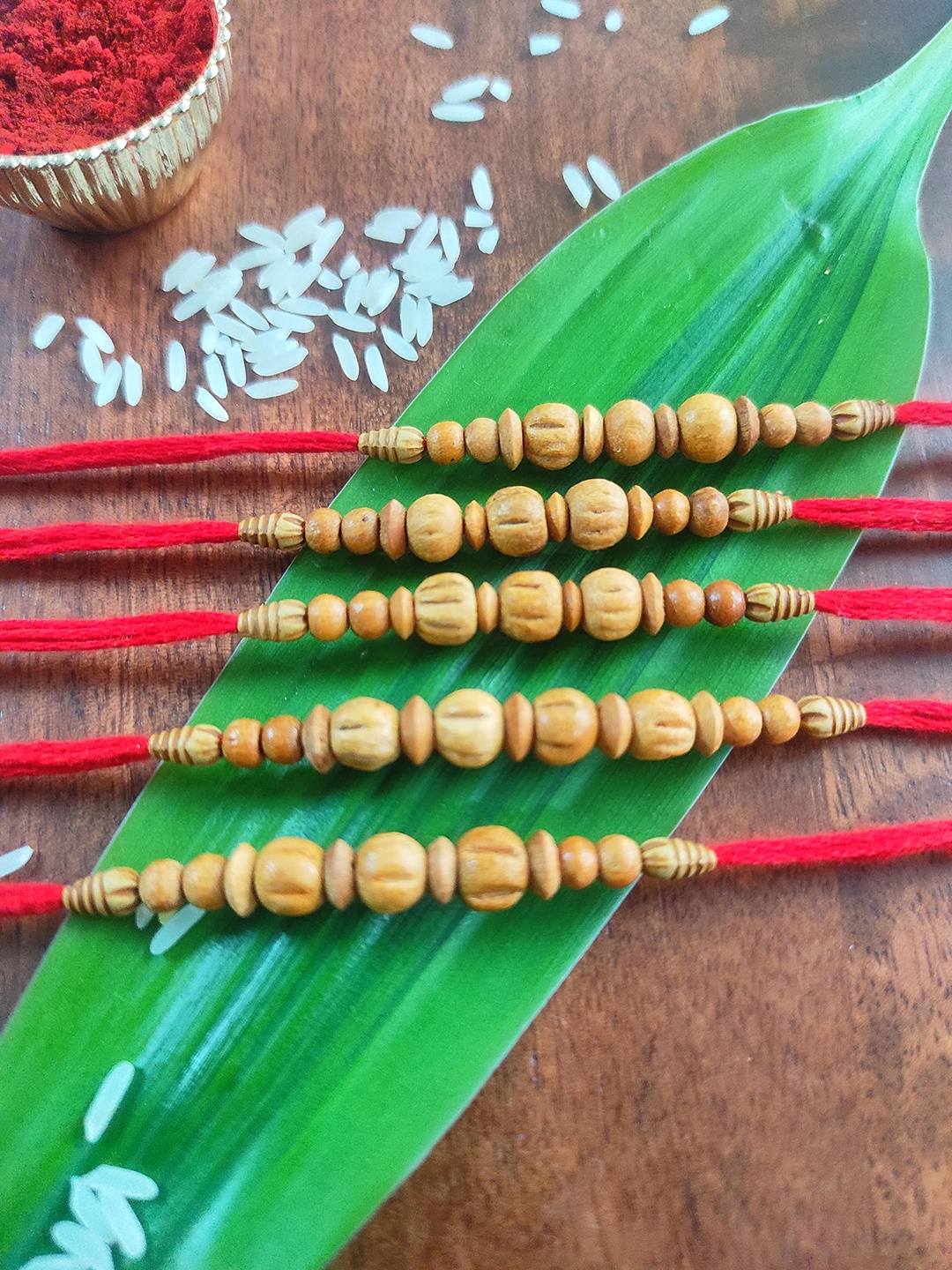 

CRAYTON Set Of 5 Red & Beige Beaded Thread Rakhi