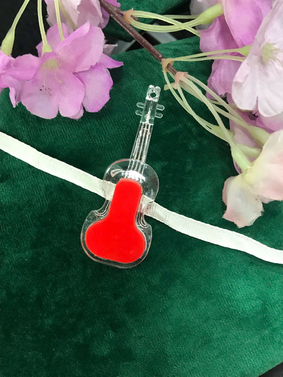 

MORKANTH JEWELLERY Boys Red & transparent Guitar Light Rakhi