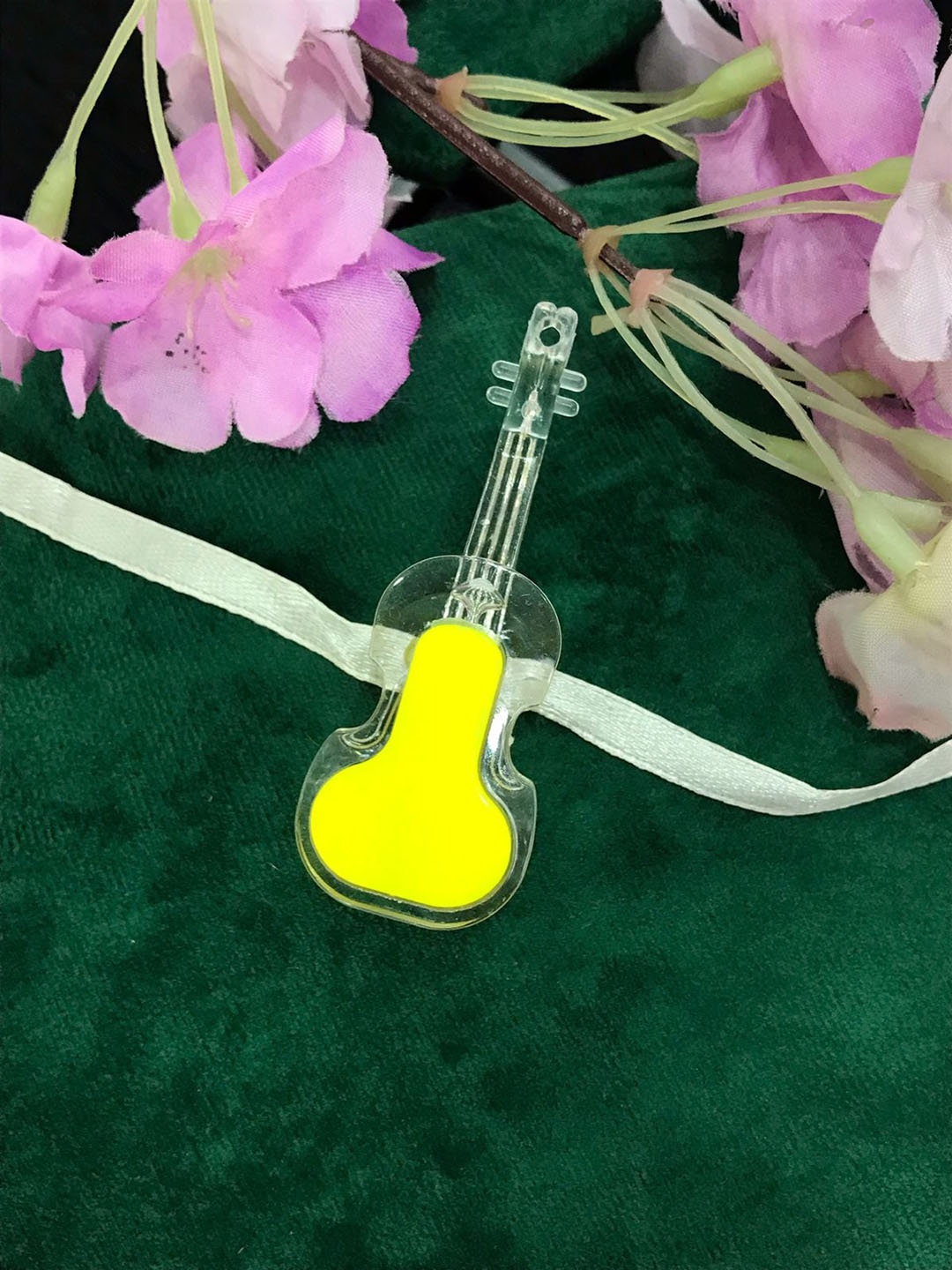 

MORKANTH JEWELLERY Boys Yellow & Transparent Guitar Light Rakhi