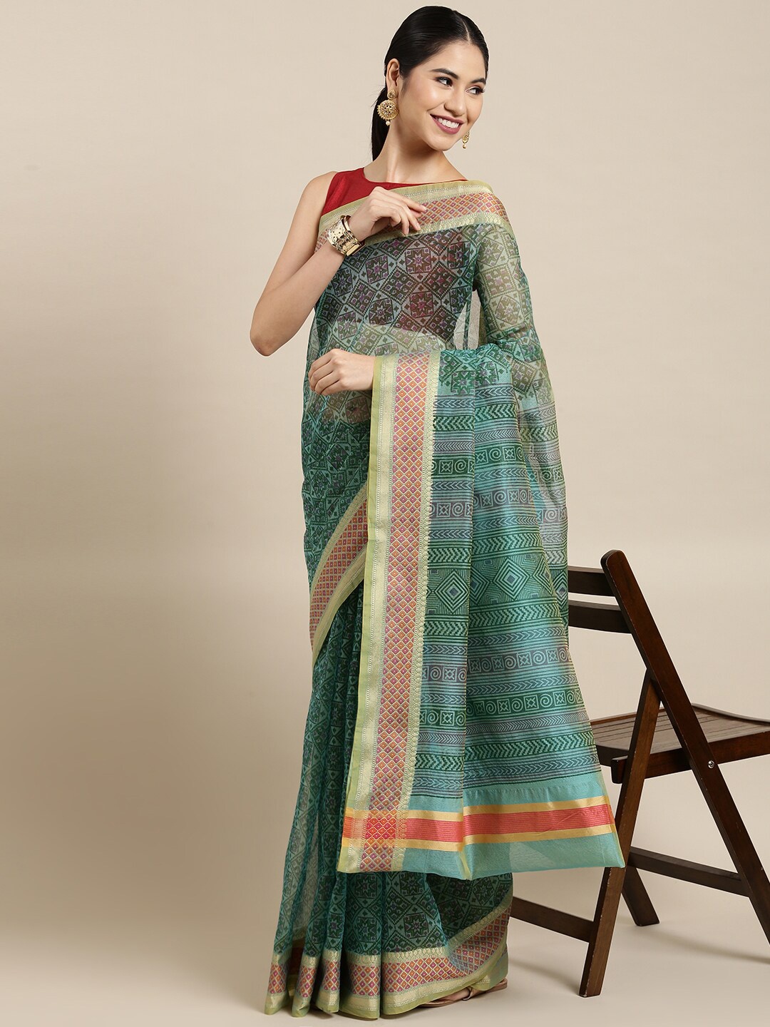 

The Chennai Silks Green Ethnic Motifs Zari Supernet Fusion Kota Saree