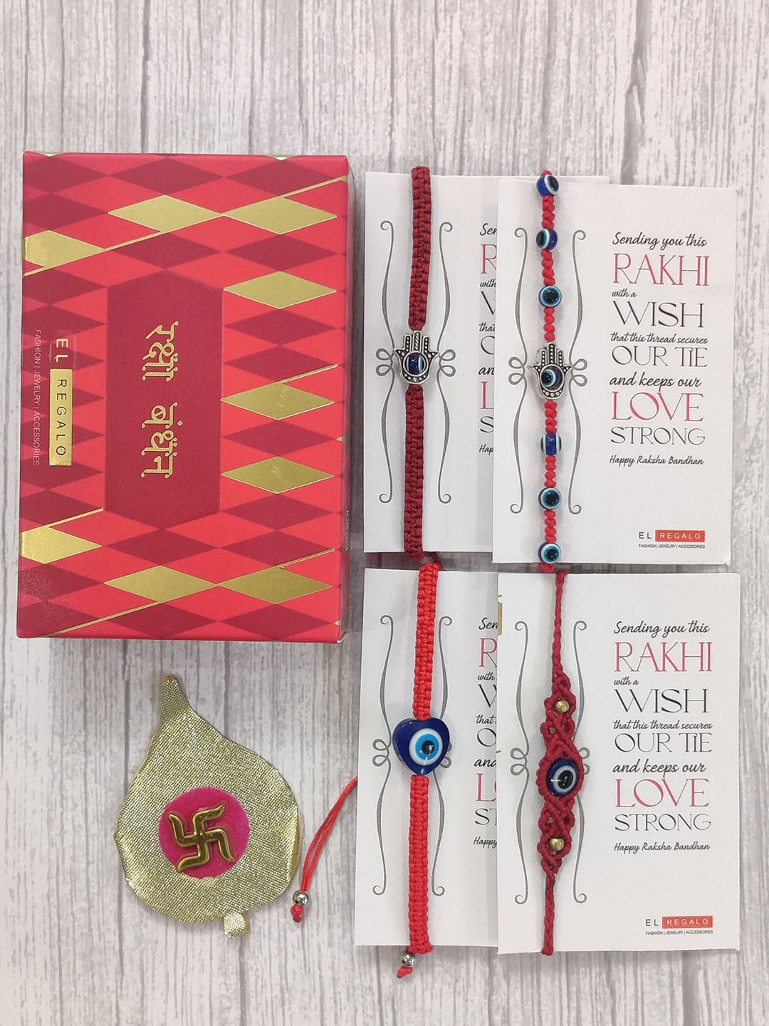 

EL REGALO Red Set Of 4 Evil Eye Rakhi With Roli Chawal & Raksha Bandhan Greeting Card