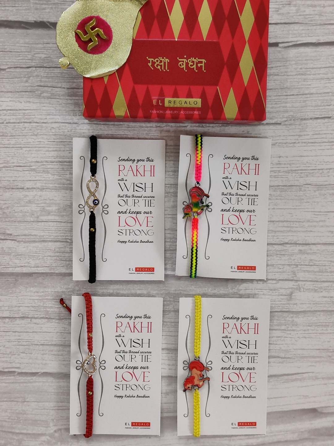 

EL REGALO Set Of 4 Stone Studded Wrap Around Rakhi With Roli Chawal & Raksha Bandhan Greeting Card, Red
