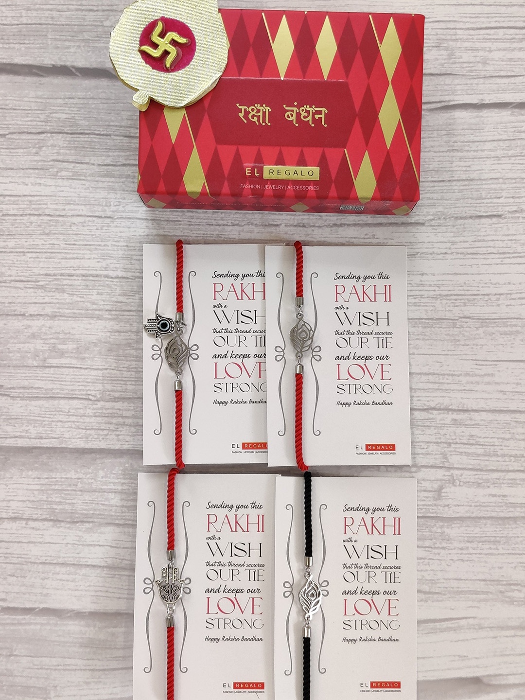 

EL REGALO Set Of 4 Silver Coloured & Red Wrap Around Rakhi With Roli Chawal & Raksha Bandhan Greeting Card