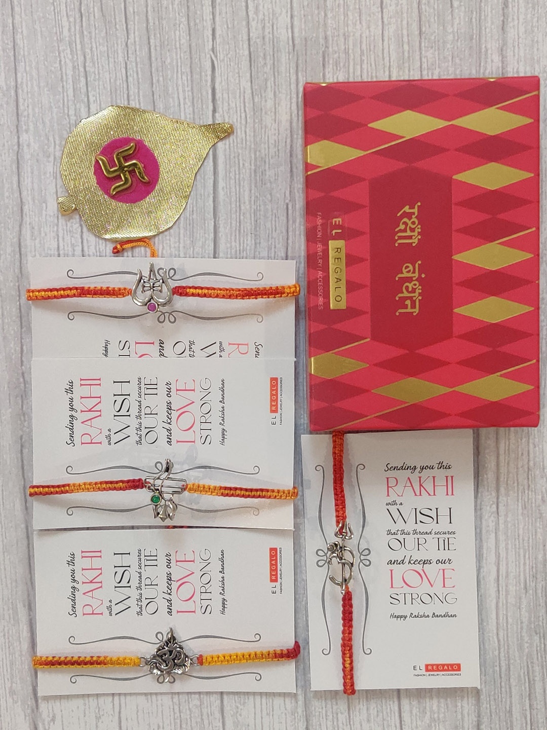 

EL REGALO Set Of 4 Silve-Coloured, Yellow & Orange Coloured Wrap Around Rakhi With Roli Chawal & Raksha Bandhan Greeting Card