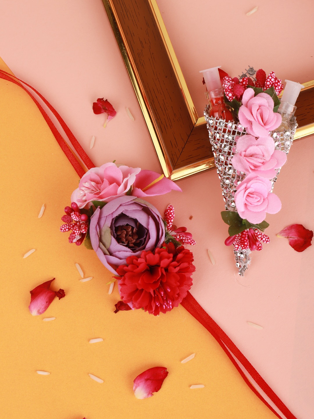 

Sanjog Pink Floral Thread Rakhi With Roli & Chawal