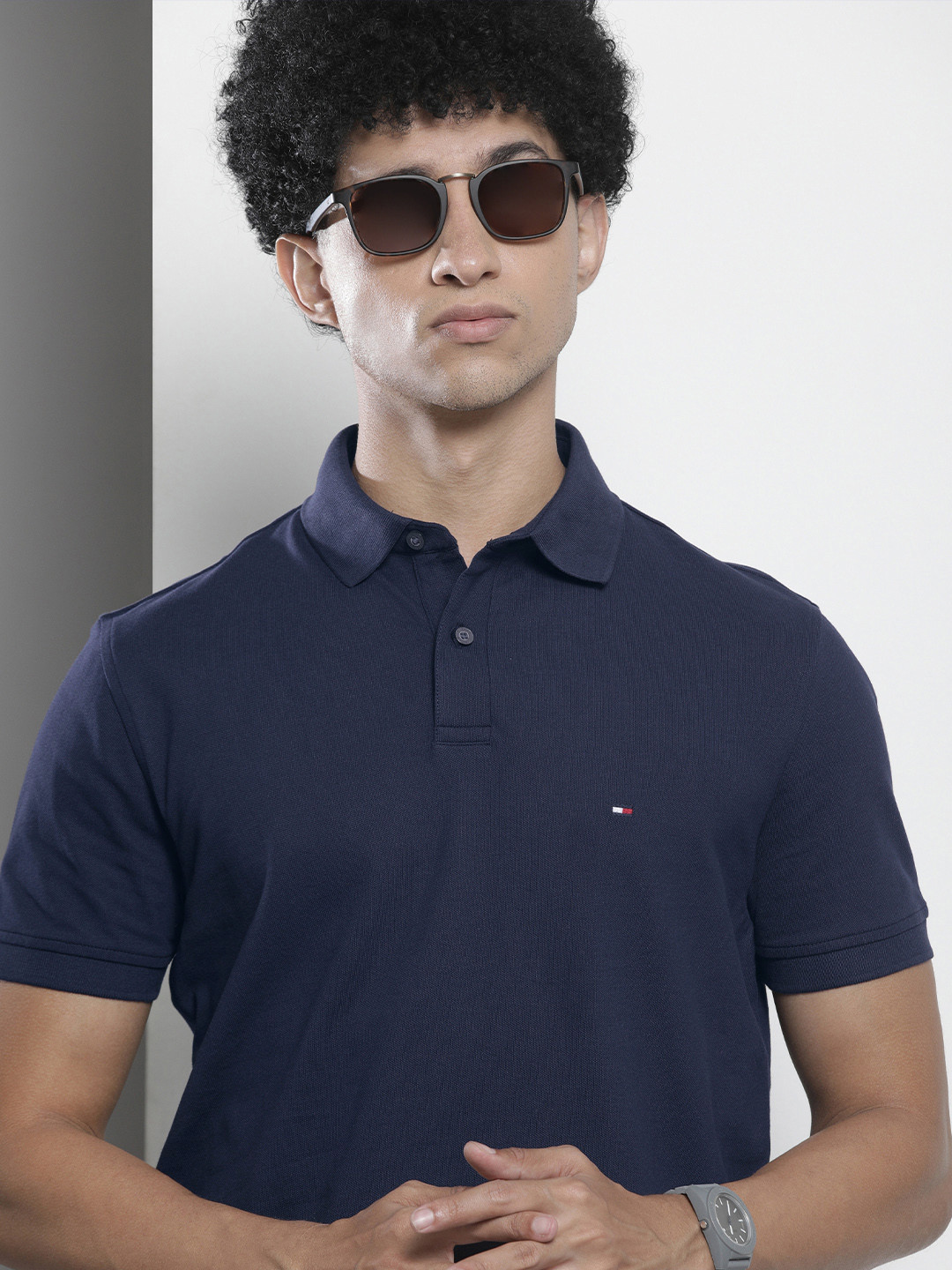 

Tommy Hilfiger Men Navy Blue Solid Polo Collar T-shirt