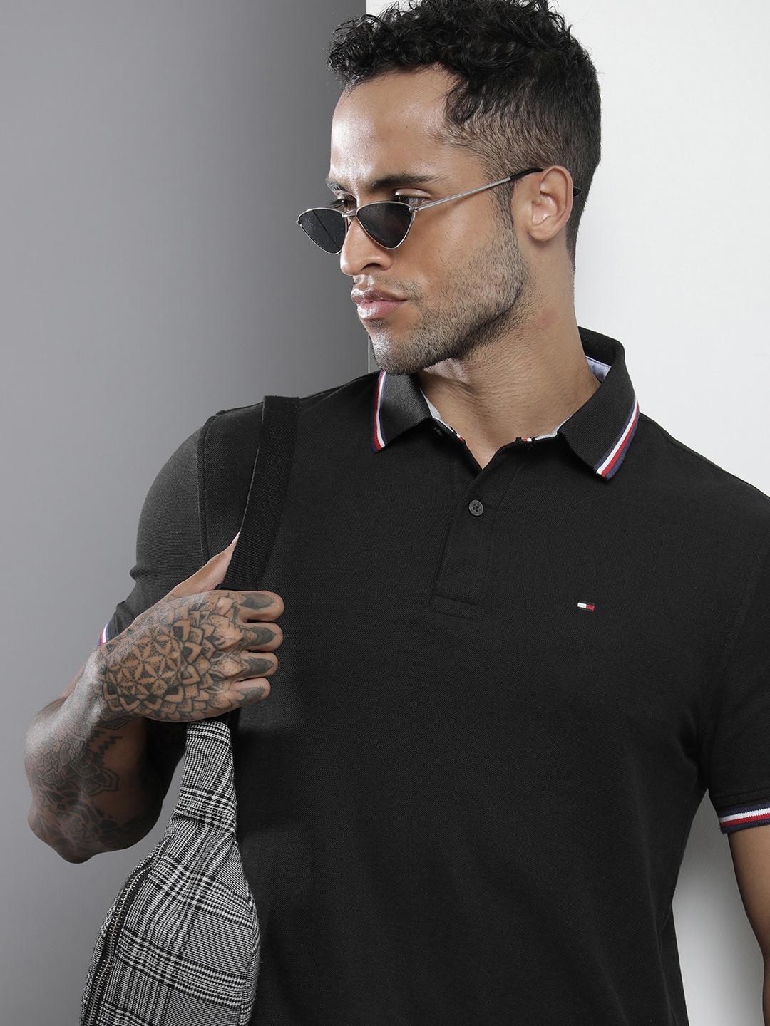 

Tommy Hilfiger Men Black Polo Collar Solid T-shirt with Brand Logo Detail