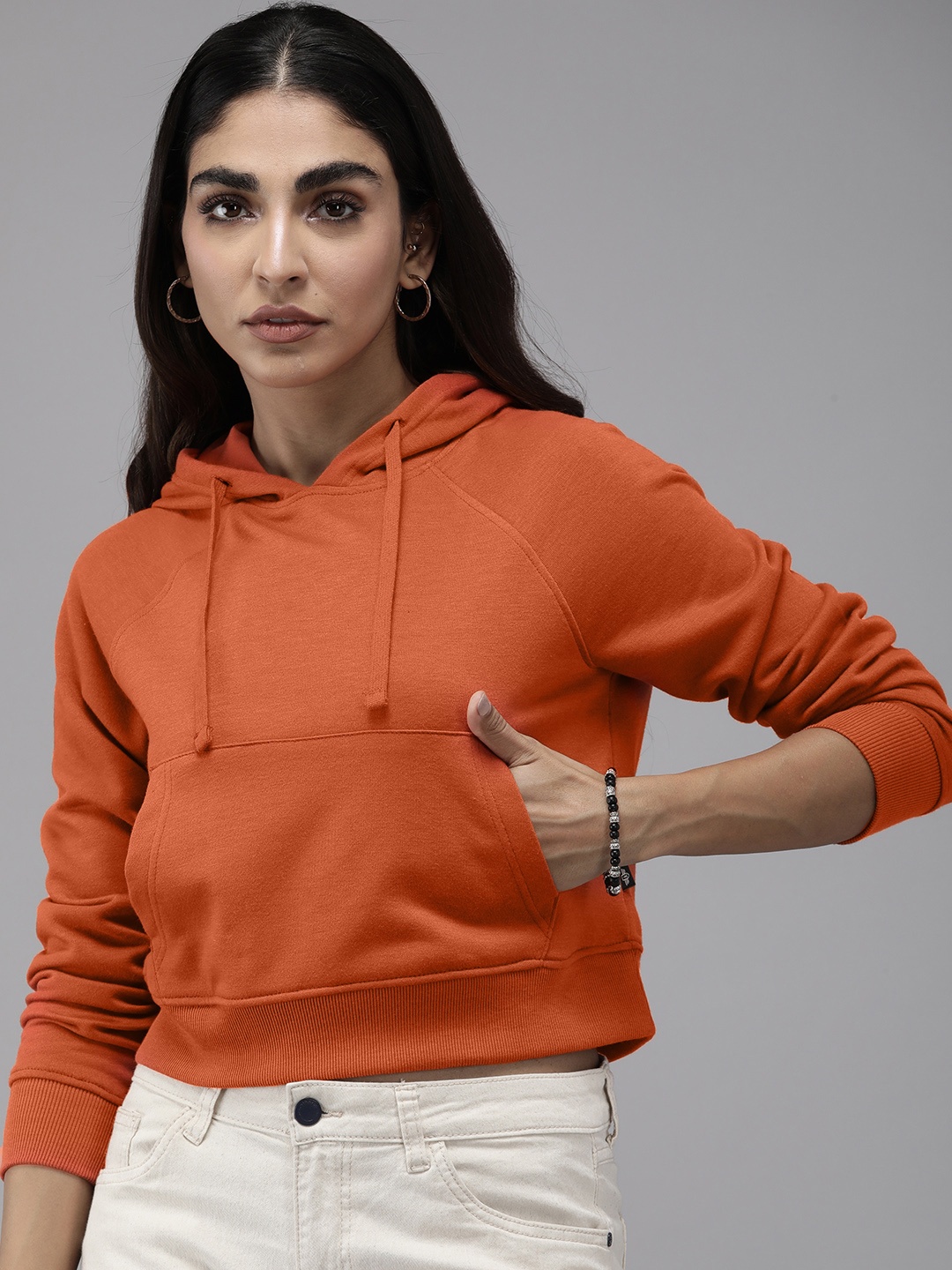 

The Roadster Lifestyle Co. Women Solid Hooded Crop Sweatshirt, Orange