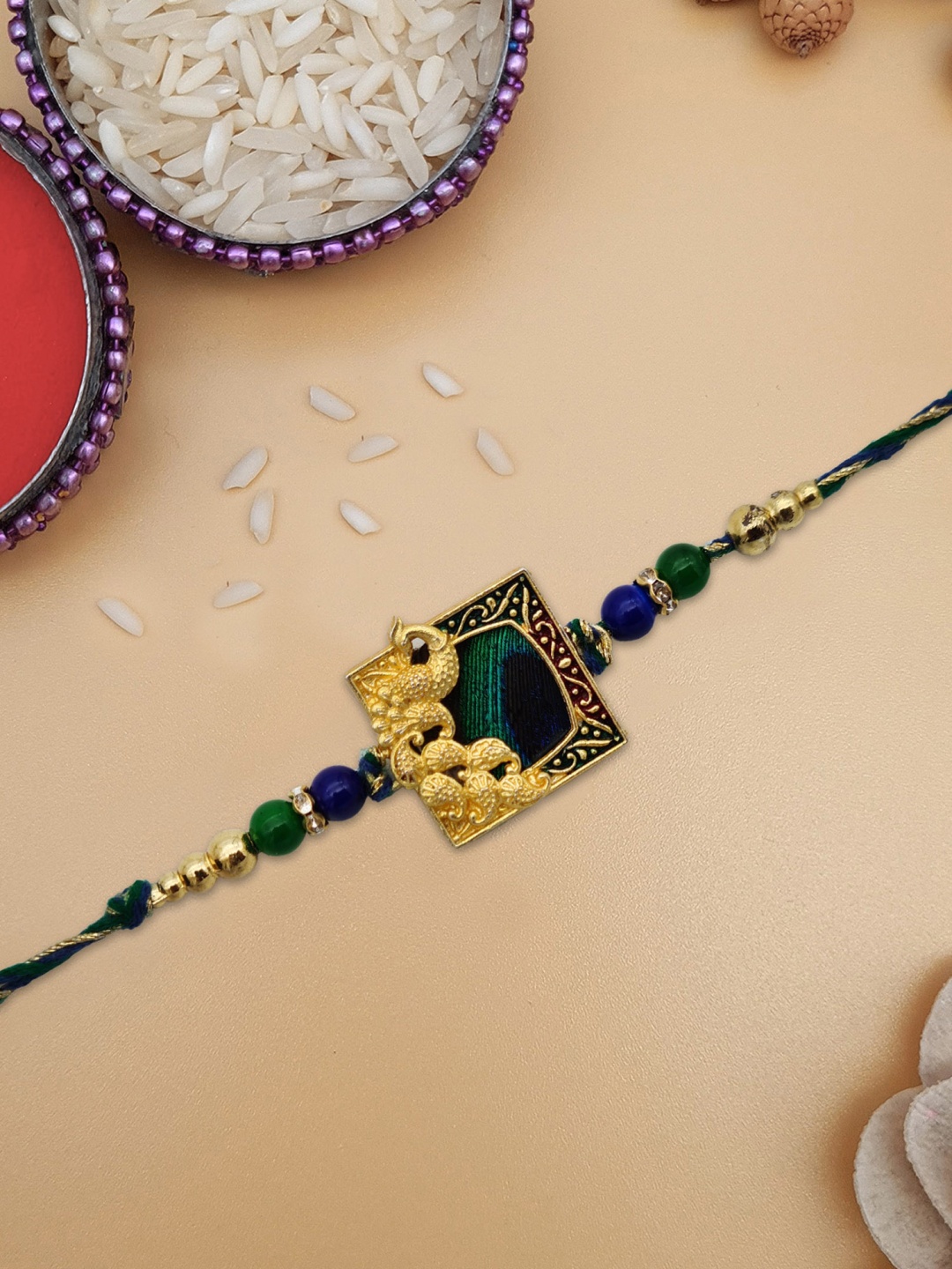 

STYBUZZ Women Gold-Toned Ganesh Rakhi With Greeting Card & Roli Chawal