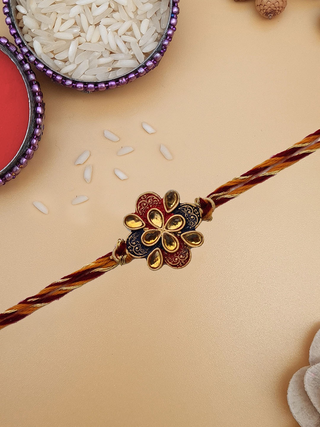

STYBUZZ Maroon Rakhi With Rolichawal & Greeting Card