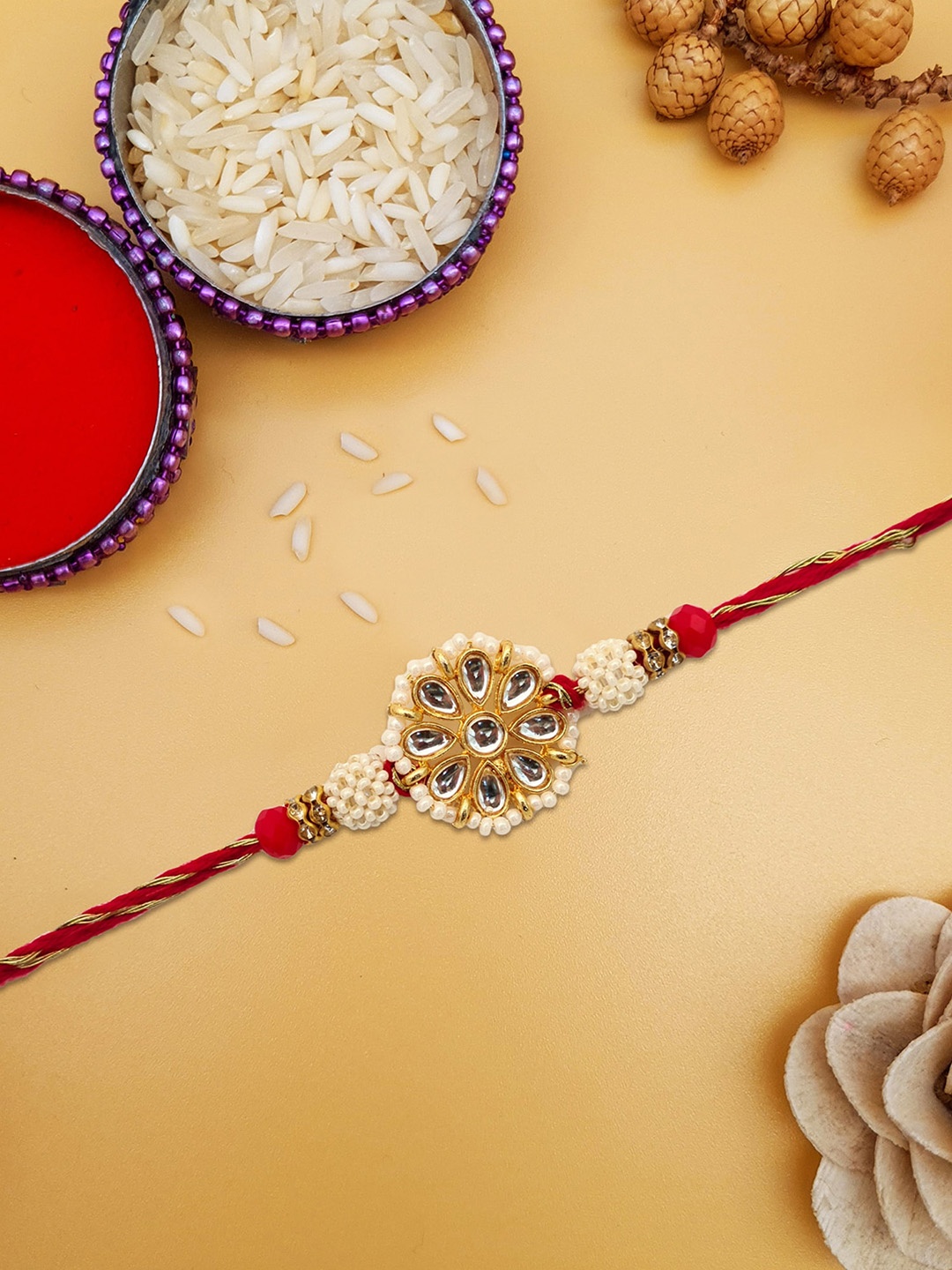

STYBUZZ Kundan studded pearl Rakhi Combo with Greeting Card and Roli Chawal (1 Rakhi), White