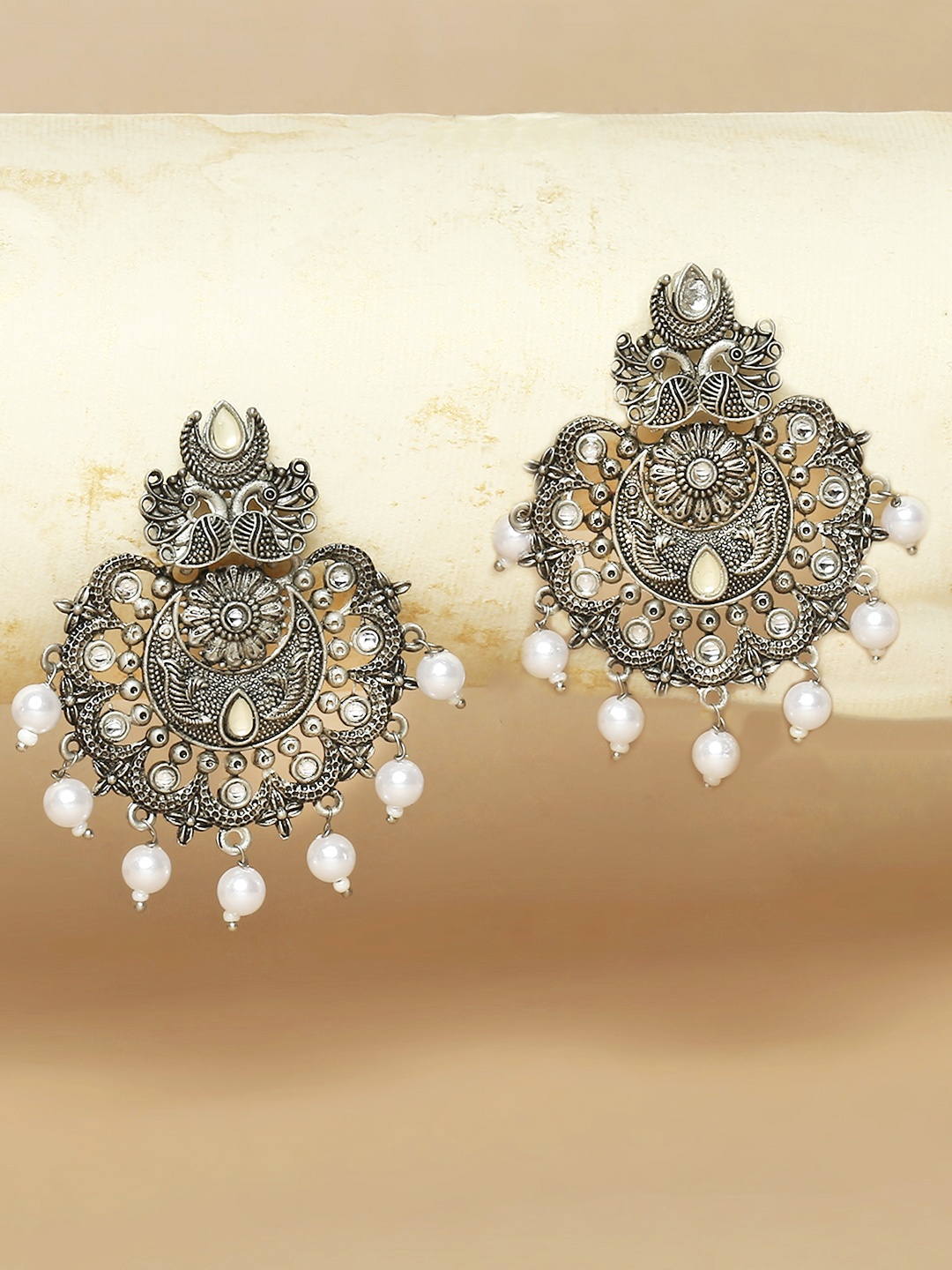 

OOMPH Silver-Toned Peacock Shaped Chandbali Earrings