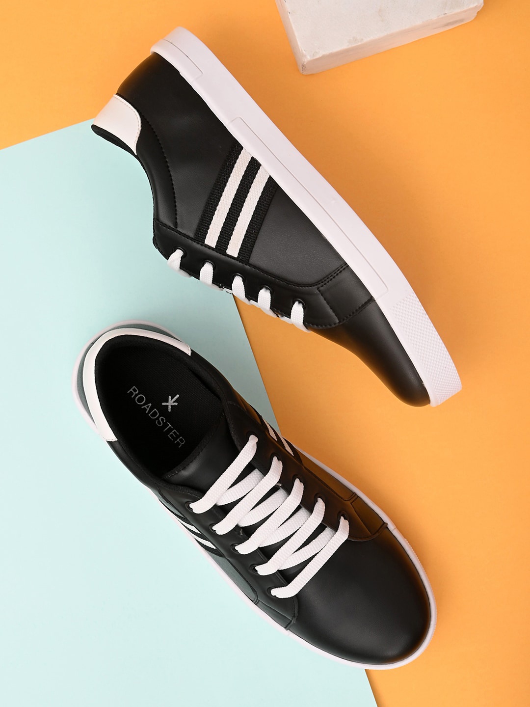 

Roadster Men Black & White Striped Sneakers
