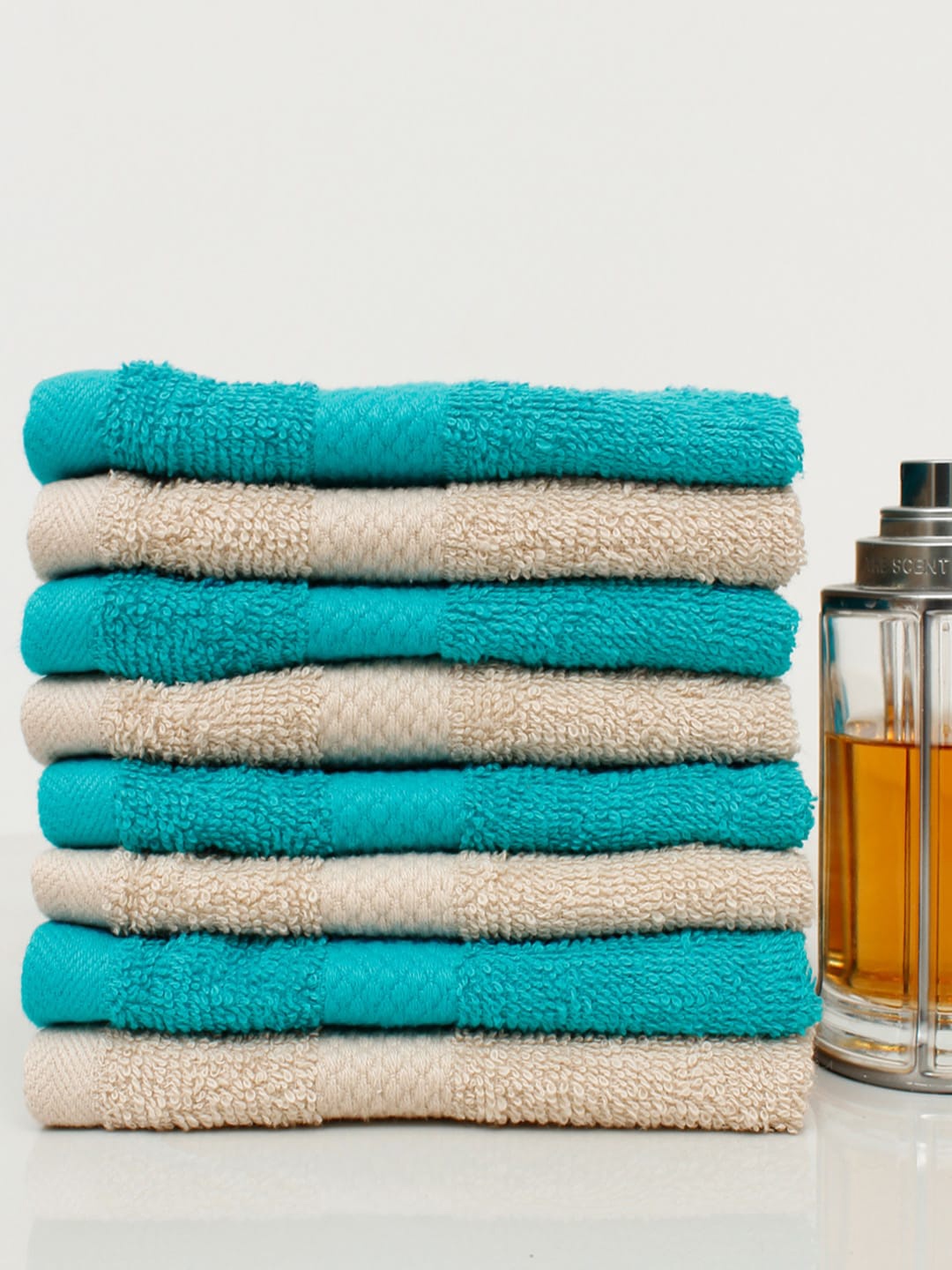

AVI Living Set Of 8 Turquoise Blue & Beige Solid 500 GSM Cotton Hand Towels