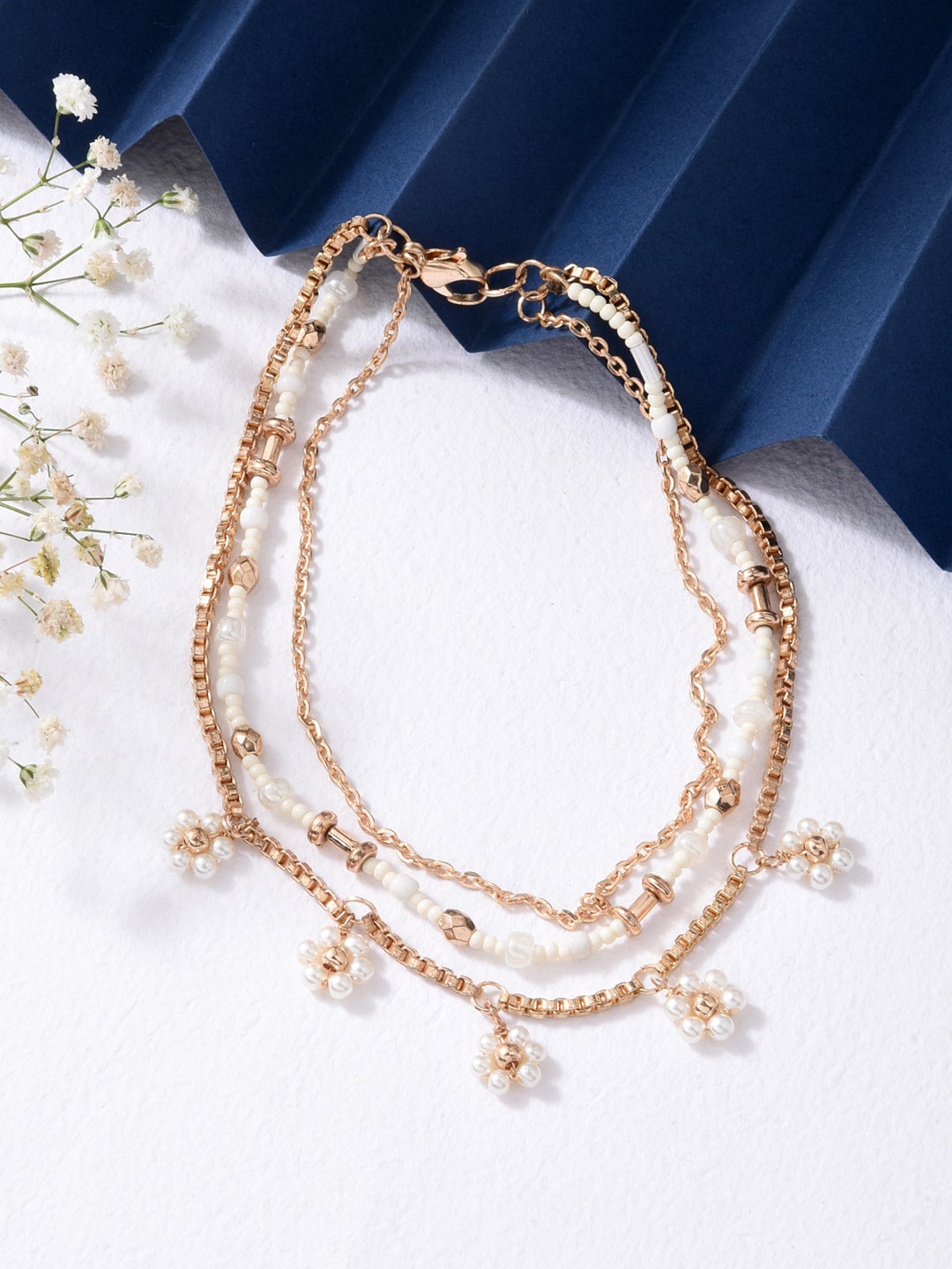 

ToniQ Women Gold & White Shiny Floral Bracelet Stack