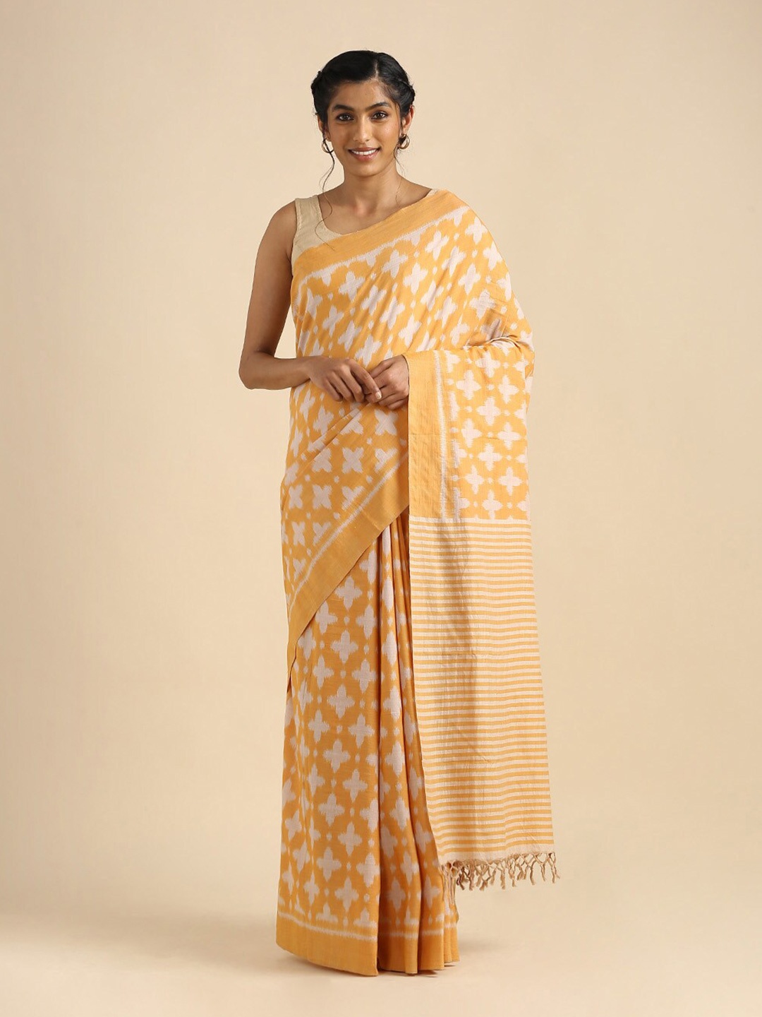 

Taneira Orange & Off White Ethnic Motifs Pure Cotton Ikat Saree
