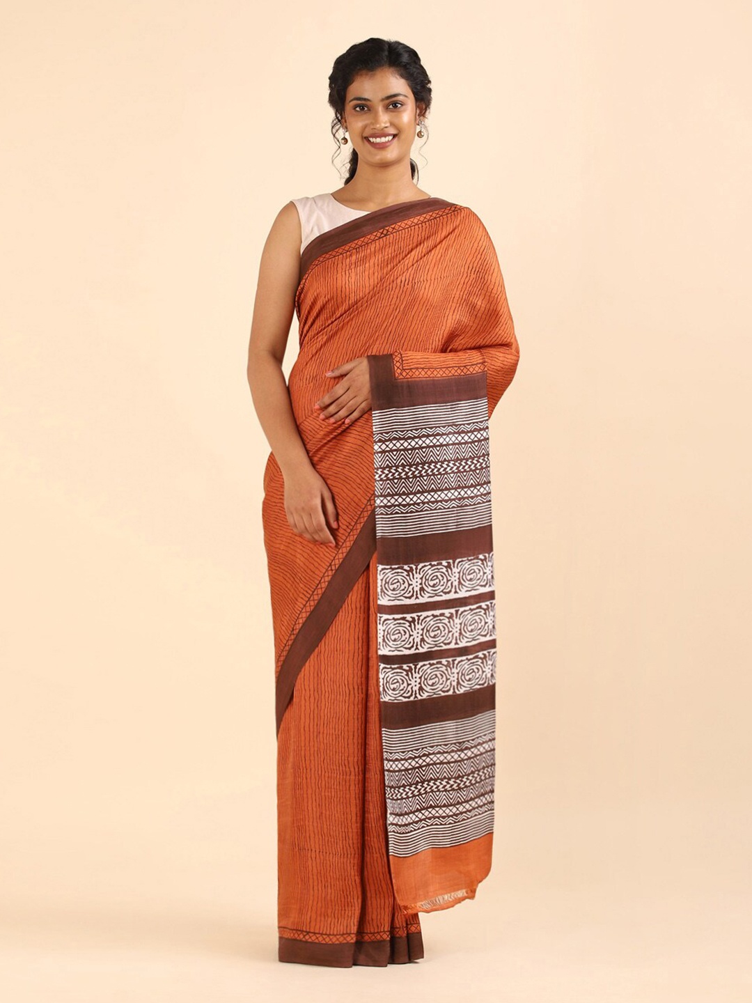 

Taneira Orange & Brown Striped Pure Silk Saree