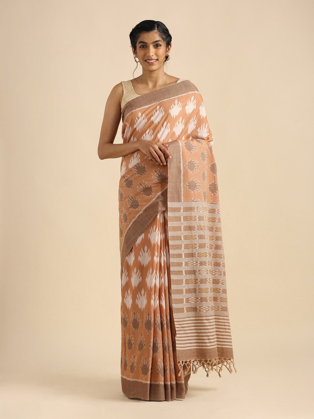 

Taneira Brown & White Zari Pure Cotton Ikat Saree