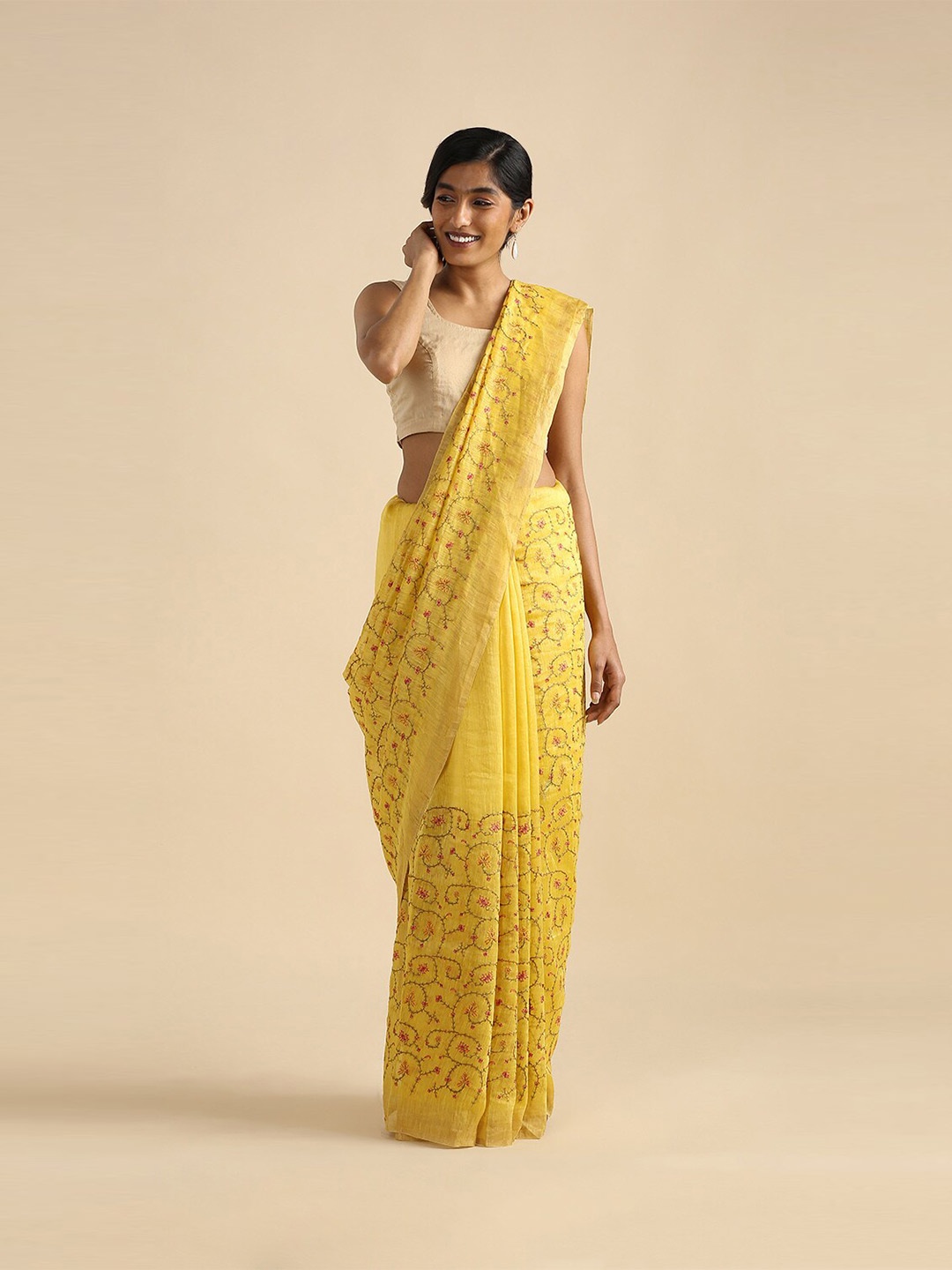 

Taneira Yellow & Red Floral Embroidered Zari Linen Blend Saree