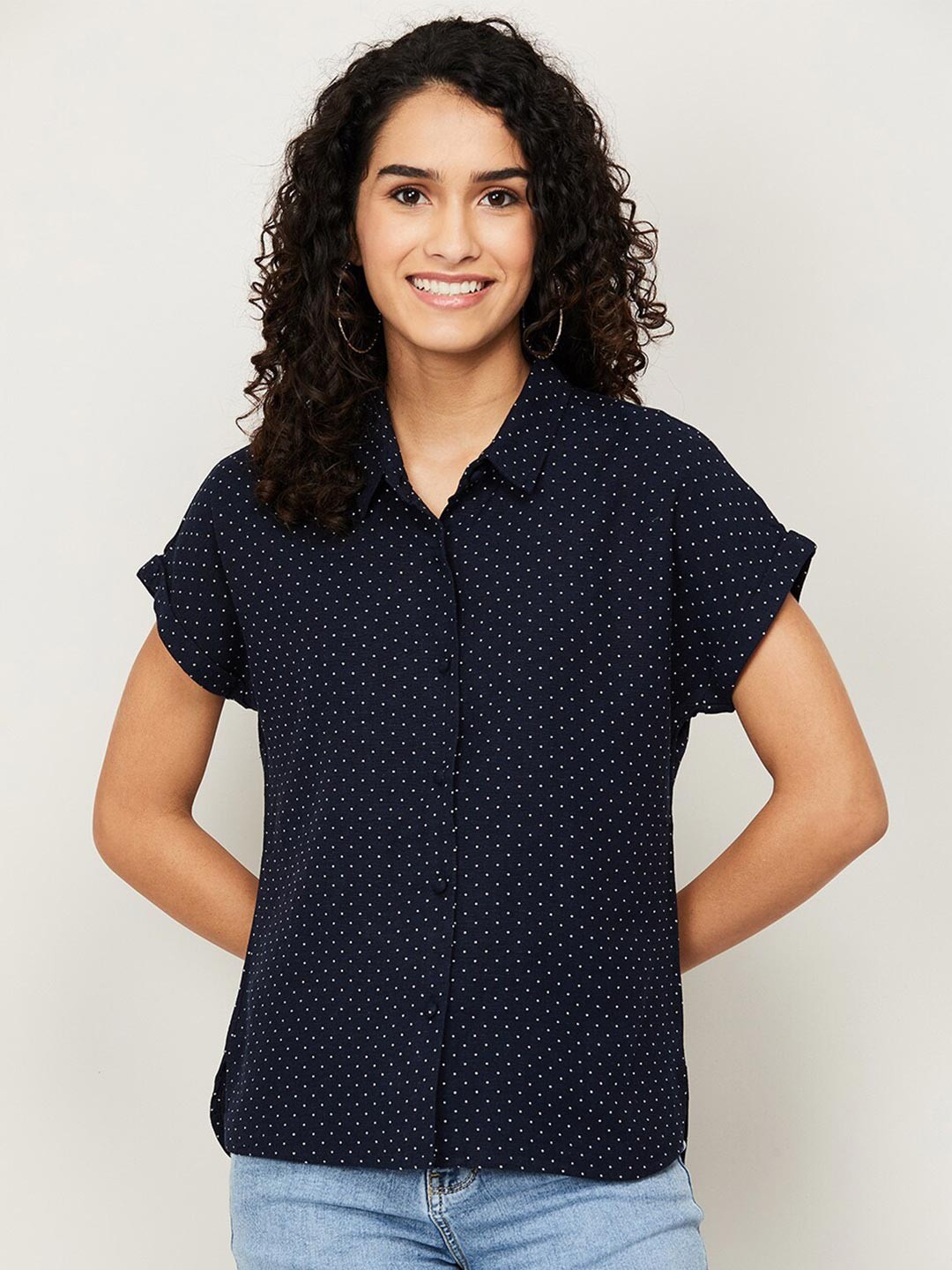 

Bossini Navy Blue Polka Dots Printed Extended Sleeved Shirt Style Top