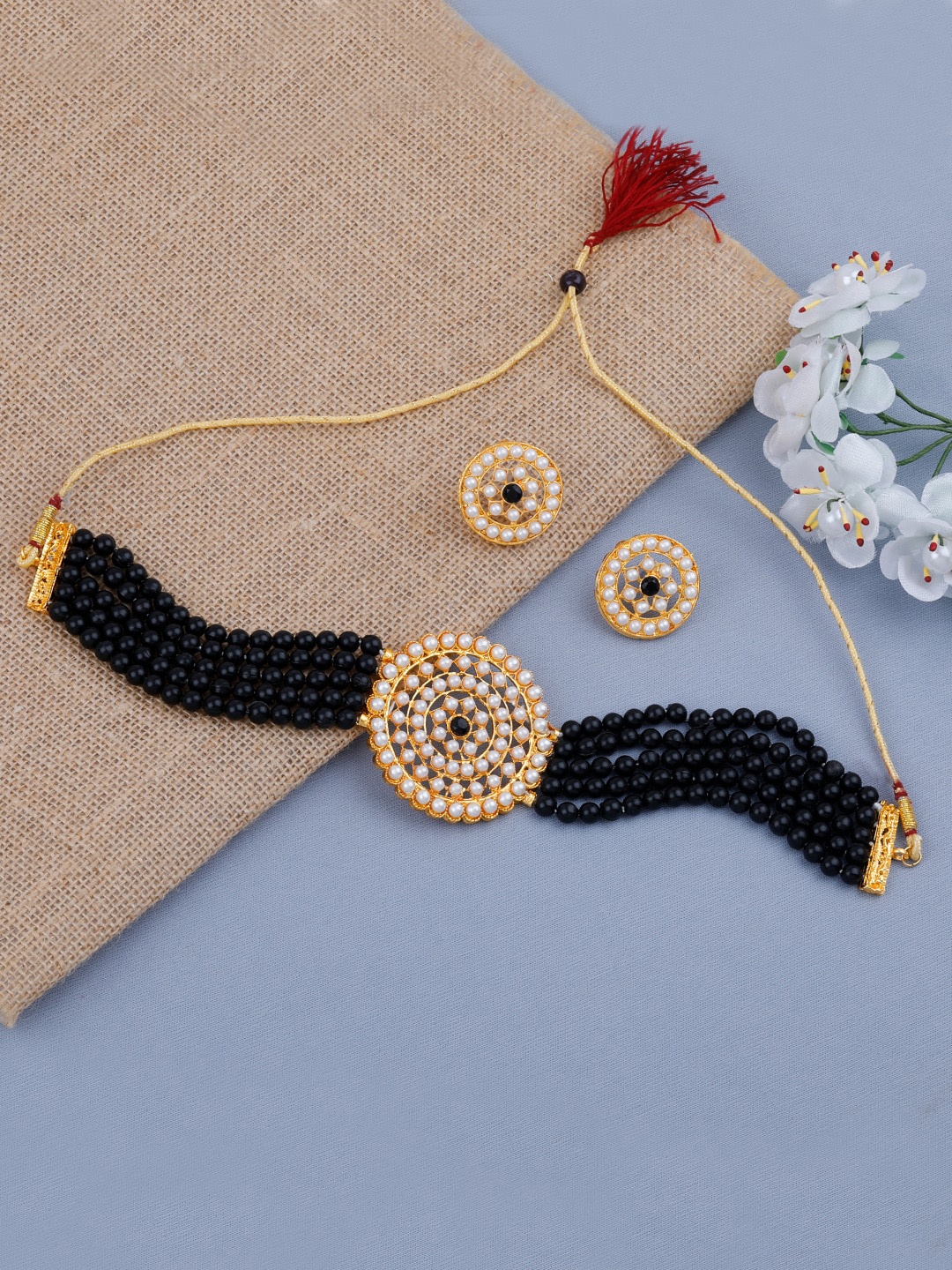 

Silver Shine Women Gold-Plated White & Black Stone-Studded & Beaded Jewellery Set
