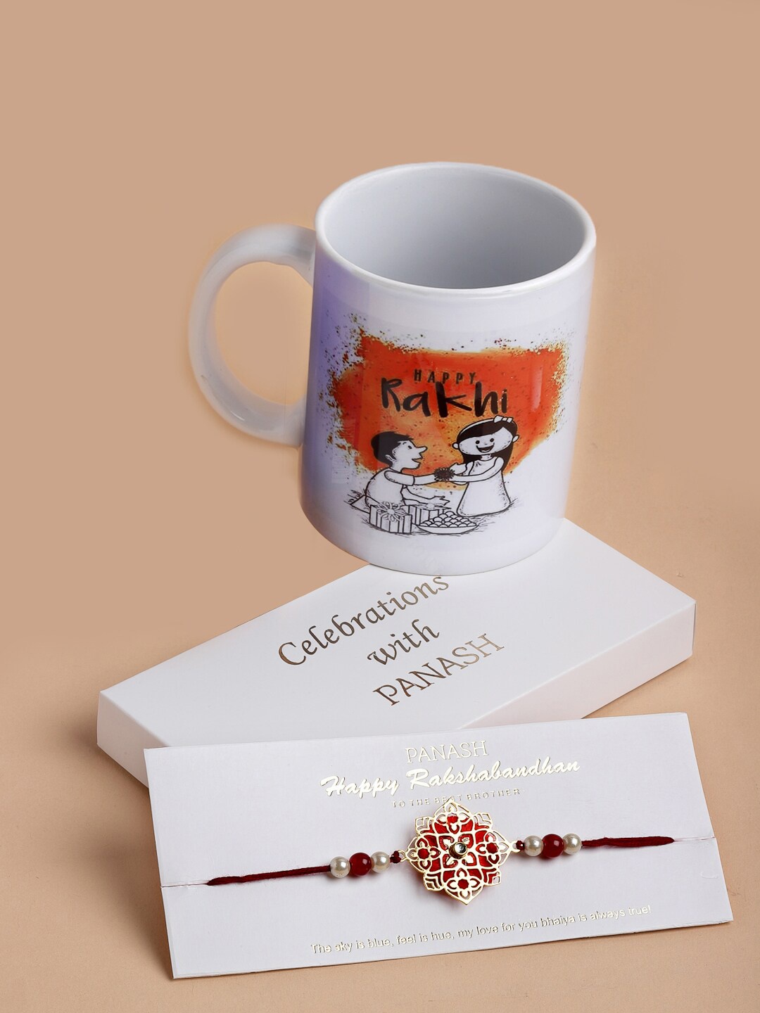 

PANASH Men Gold-Toned & Red Pearl Rakhi with Mug Gift Set