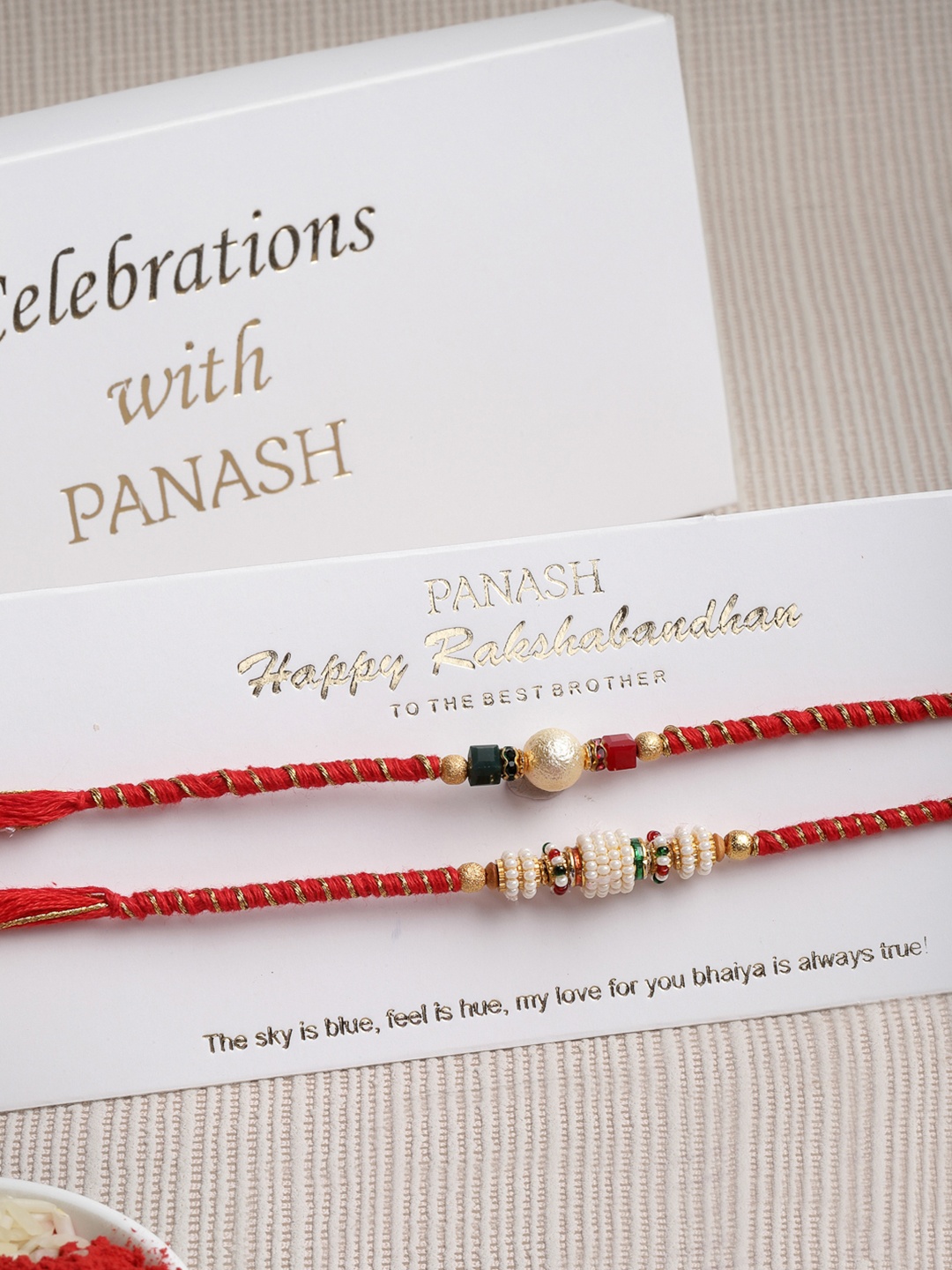 

PANASH Set Of 2 Gold Toned & Red Beaded Handcrafted Rakhi