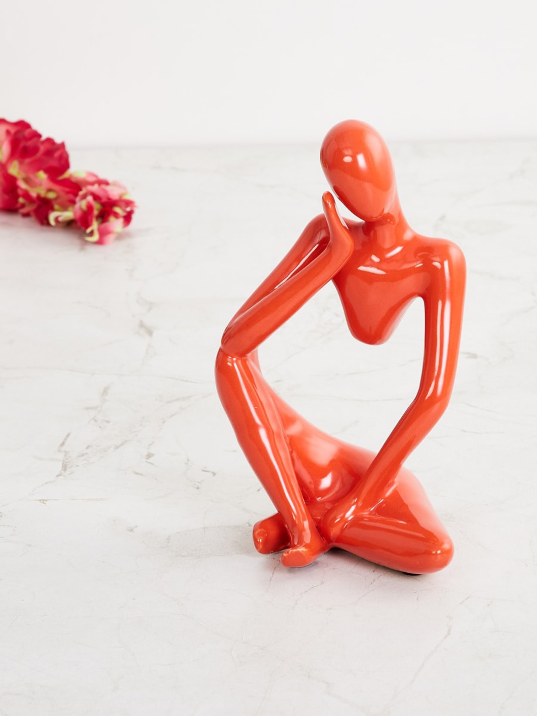 

Home Centre Orange Solid Ceramic Figurine Showpiece