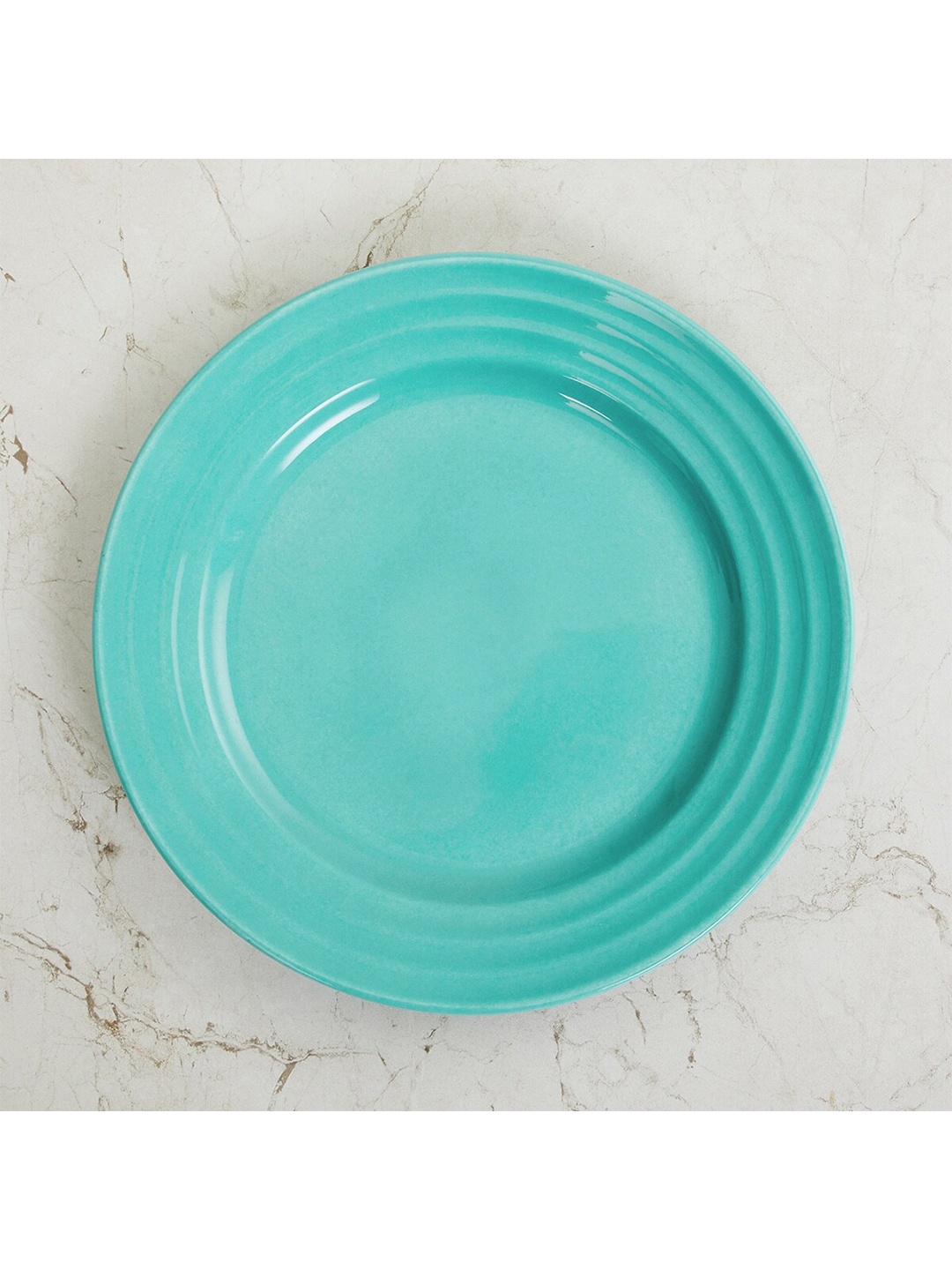 

Home Centre Blue & 1 Pieces Bone China Glossy Plates