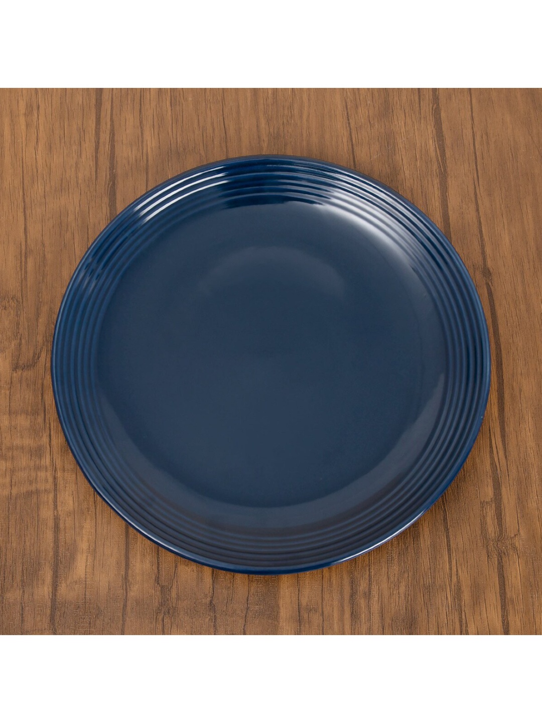 

Home Centre Blue & 1 Pieces Stoneware Glossy Plates