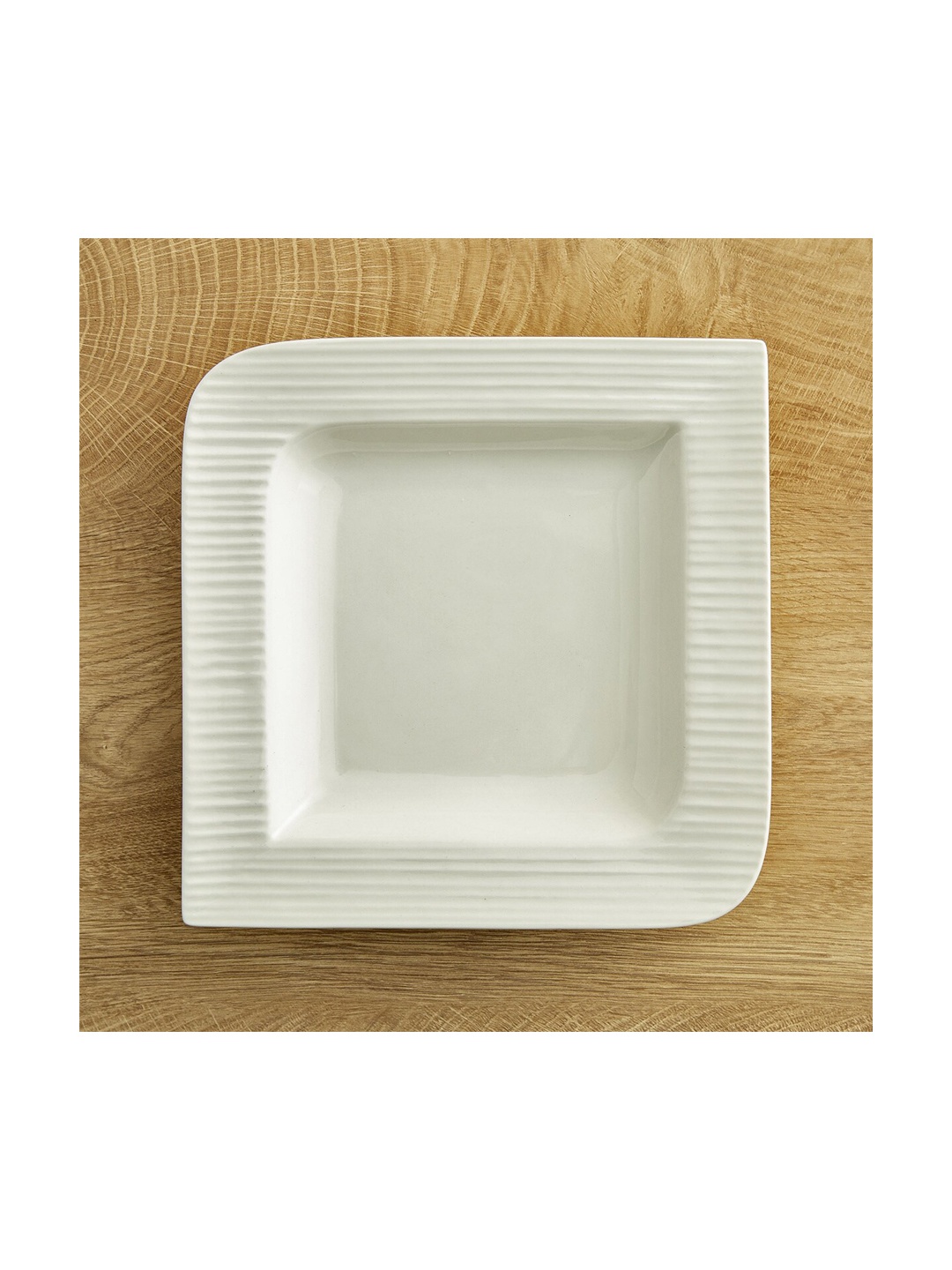 

Home Centre White & 1 Pieces Bone China Matte Plates