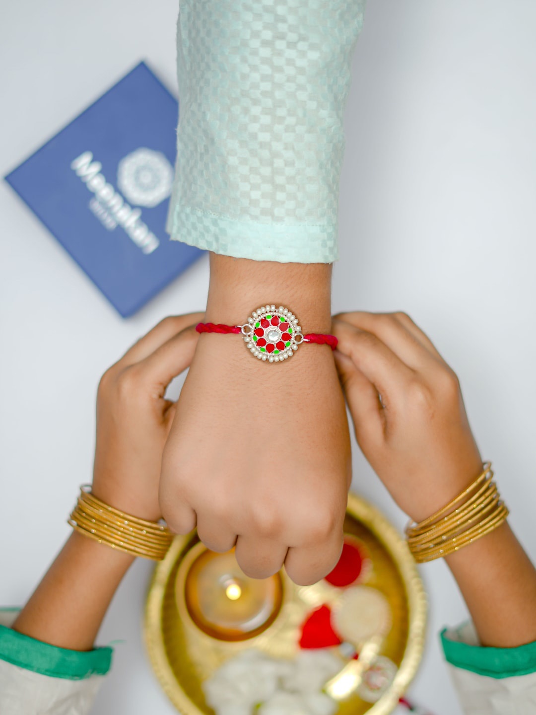 

Meenakari Heritage Jewellery 92.5 Pure Sterling Silver & Red Kundan Bhaiya Bhabhi Rakhi