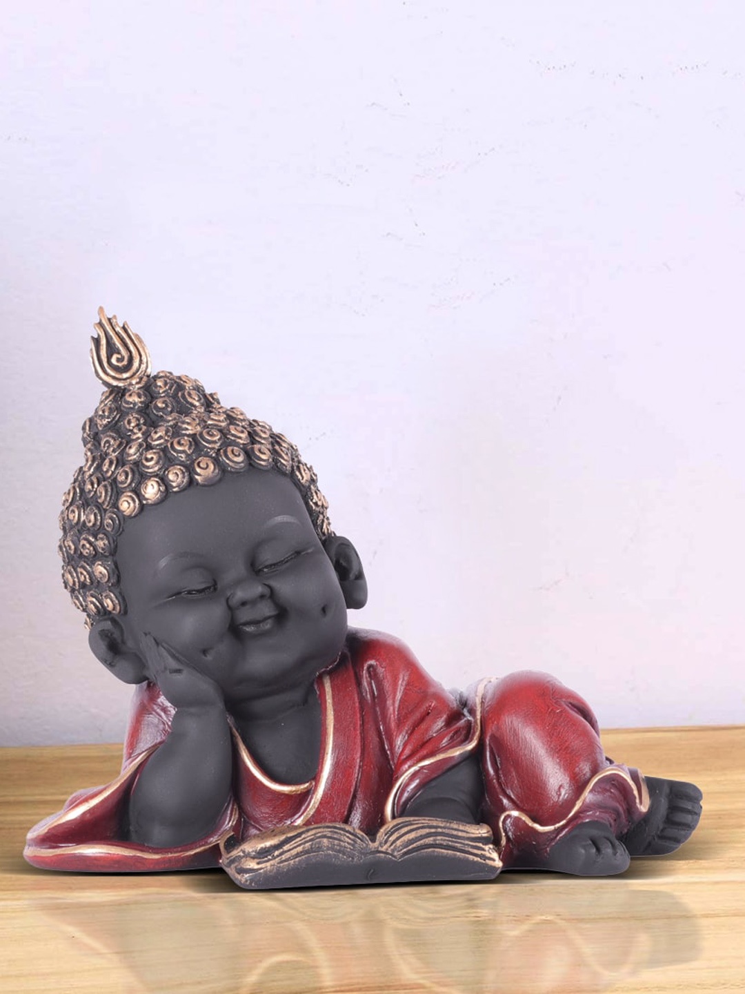 

HomeTown Black & Red Textured Reading Monk Showpieces