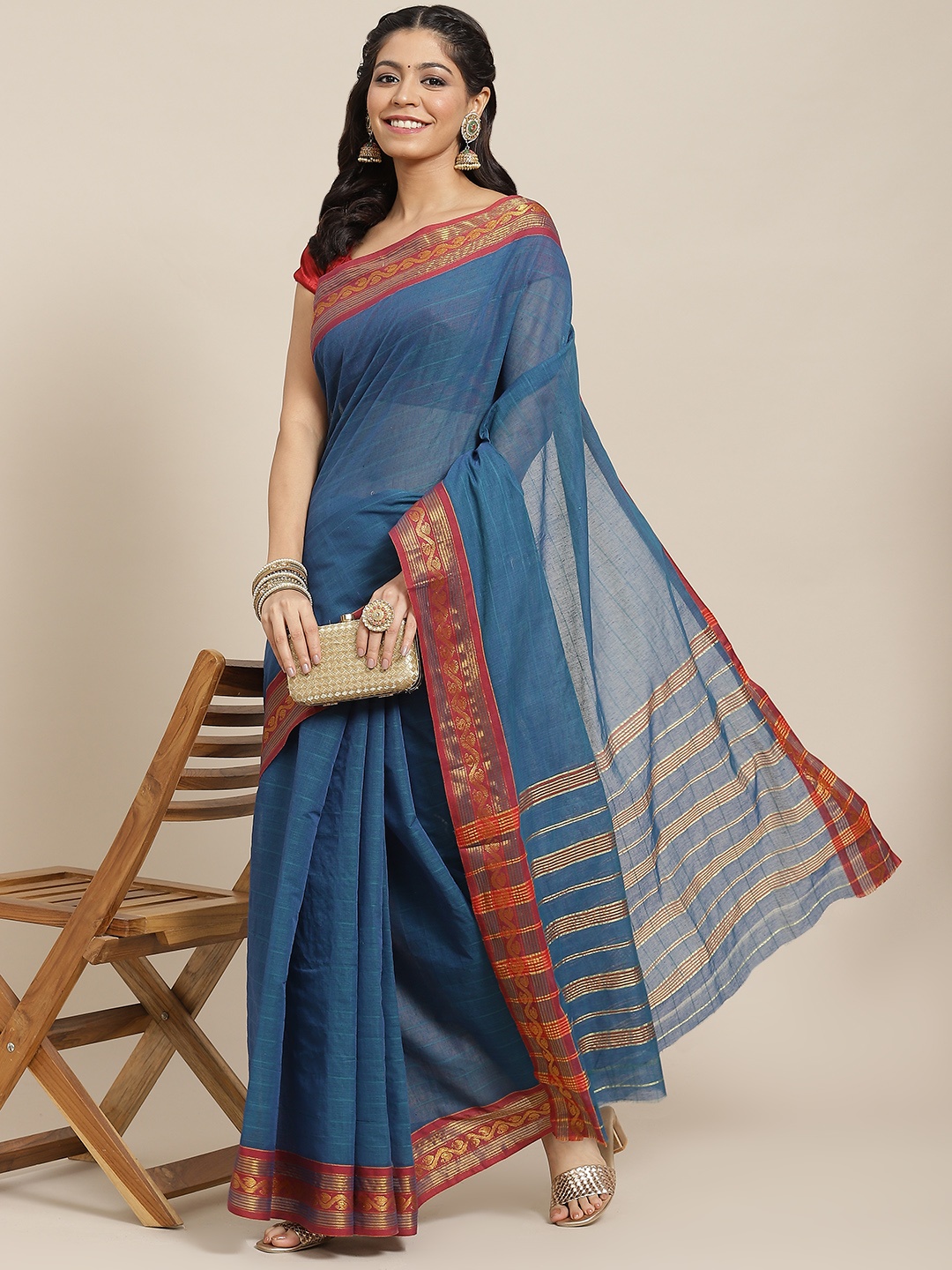 

Ishin Teal & Red Zari Solid Saree with Woven Border