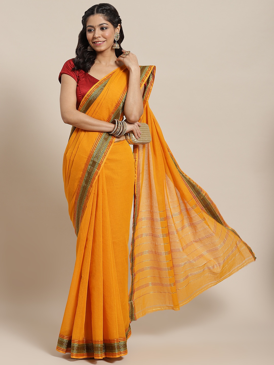 

Ishin Mustard Solid Zari Cotton Blend Saree