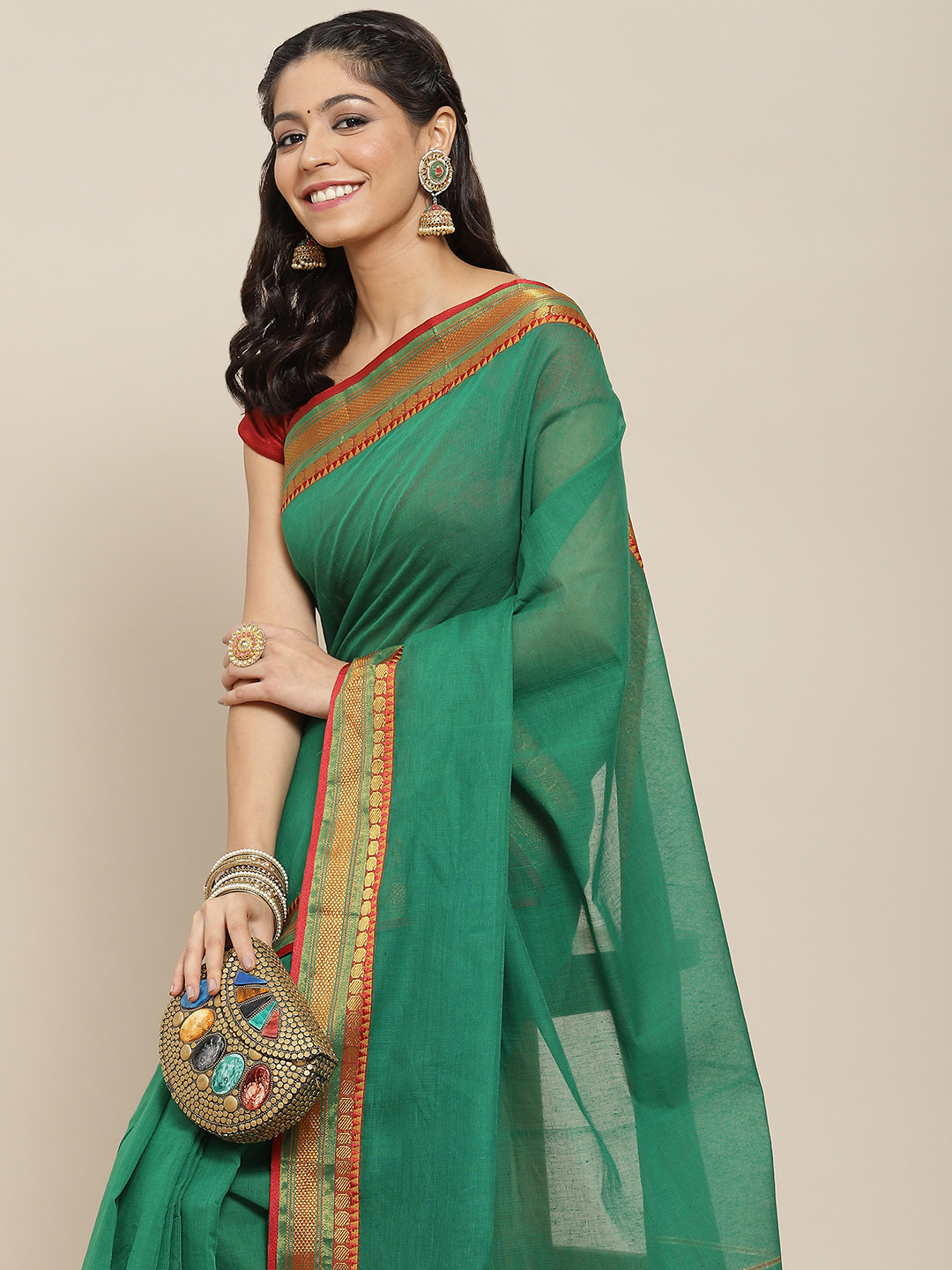 

Ishin Green Solid Zari Cotton Blend Saree