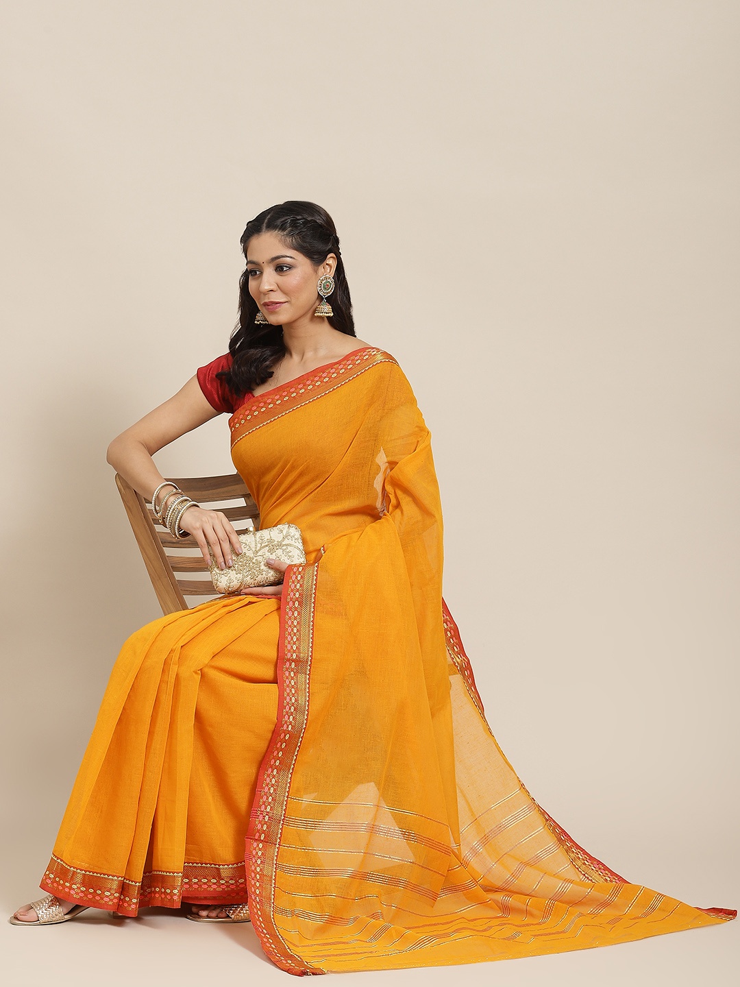 

Ishin Mustard & Orange Solid Zari Saree with Woven Border