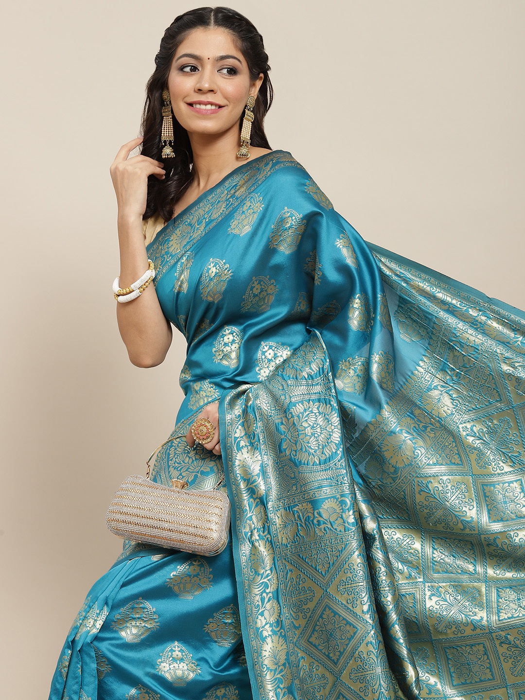 

Ishin Turquoise Blue & Golden Ethnic Motifs Zari Art Silk Banarasi Saree
