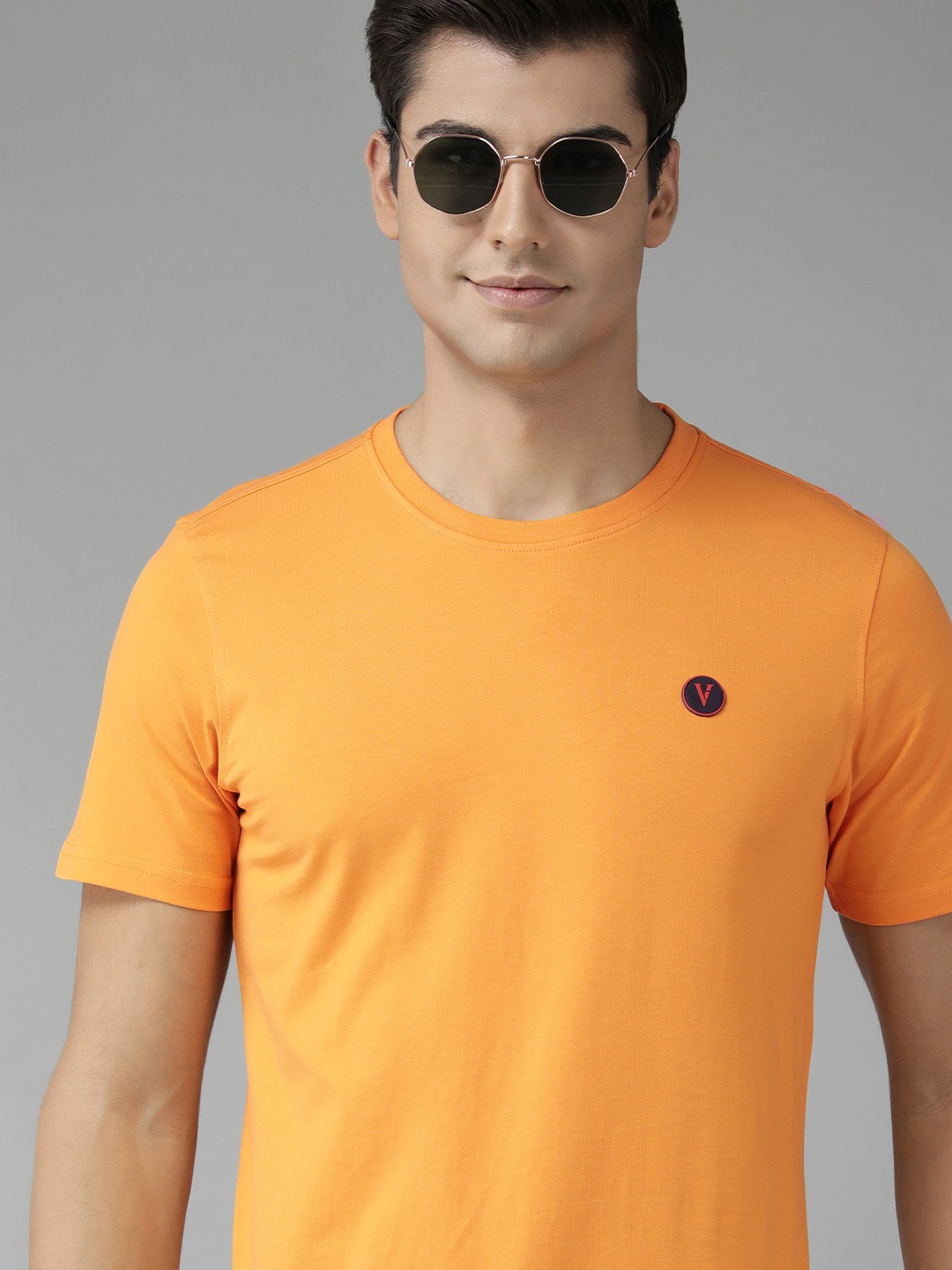 

Van Heusen Sport Men Yellow Solid Pure Cotton Brand Logo Applique Slim Fit T-shirt