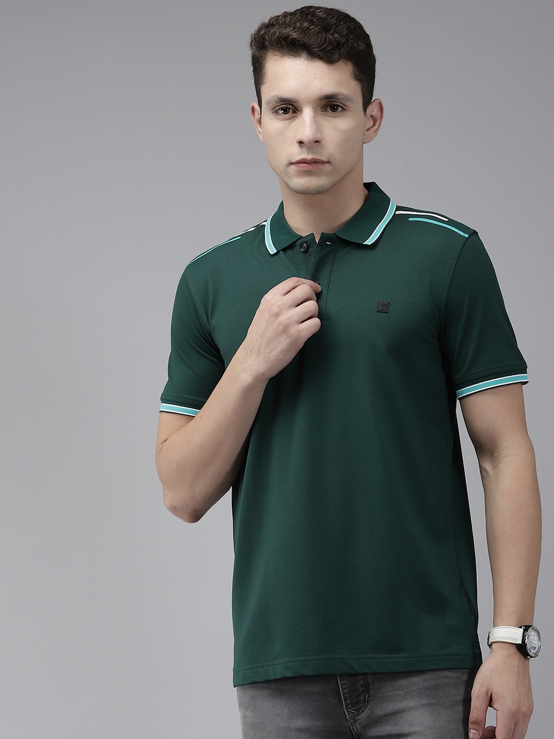 

Van Heusen Sport Men Green Solid Polo Collar T-shirt